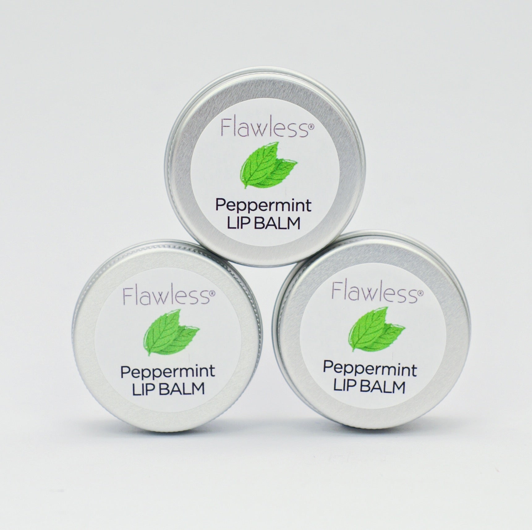 A tin of Peppermint Lip Balm featuring a minty green color, showcasing its eco-friendly packaging and natural ingredients.