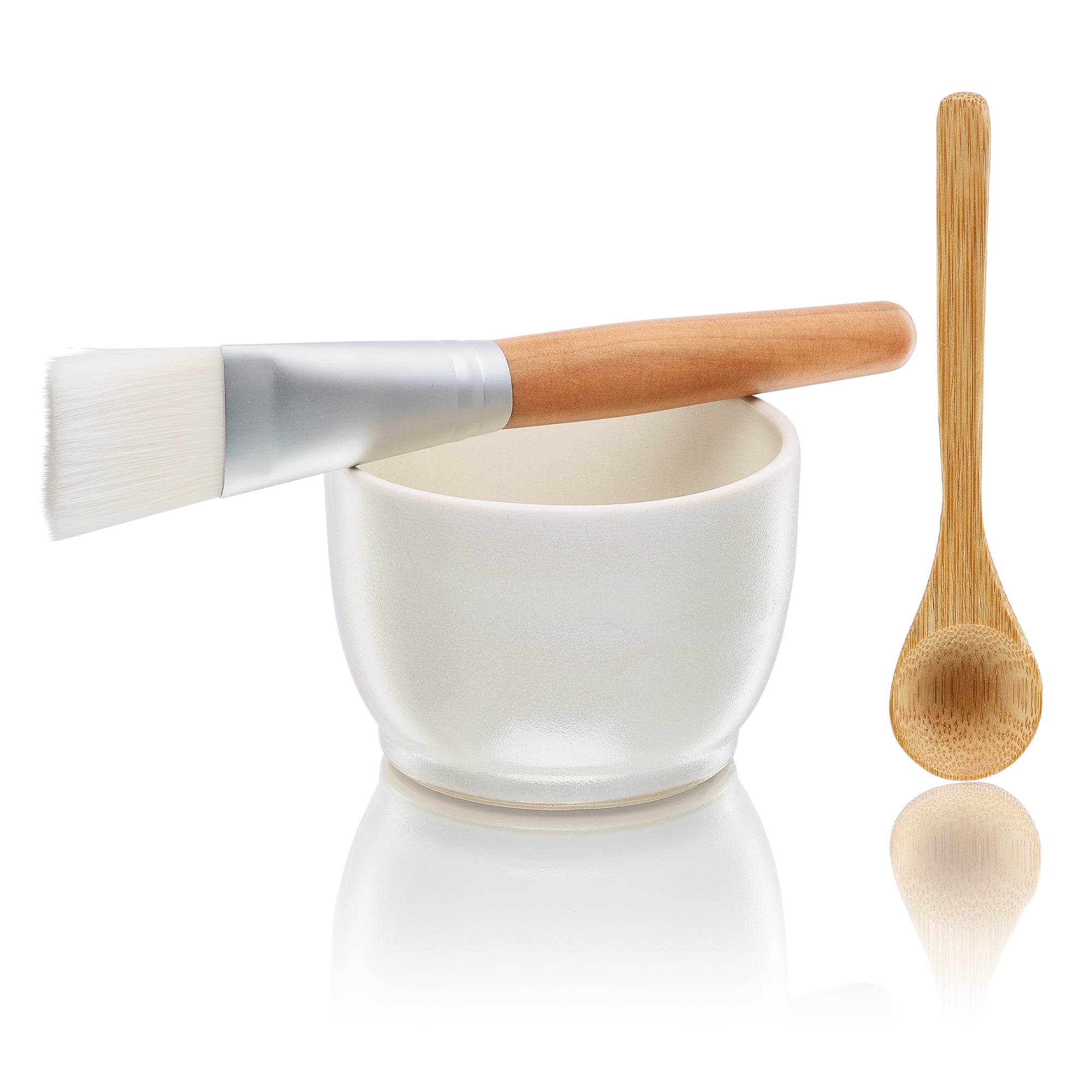 Elegant Mask Bowl Kit featuring a handmade ceramic bowl, cruelty-free mask brush, and natural wood spoon for skincare.