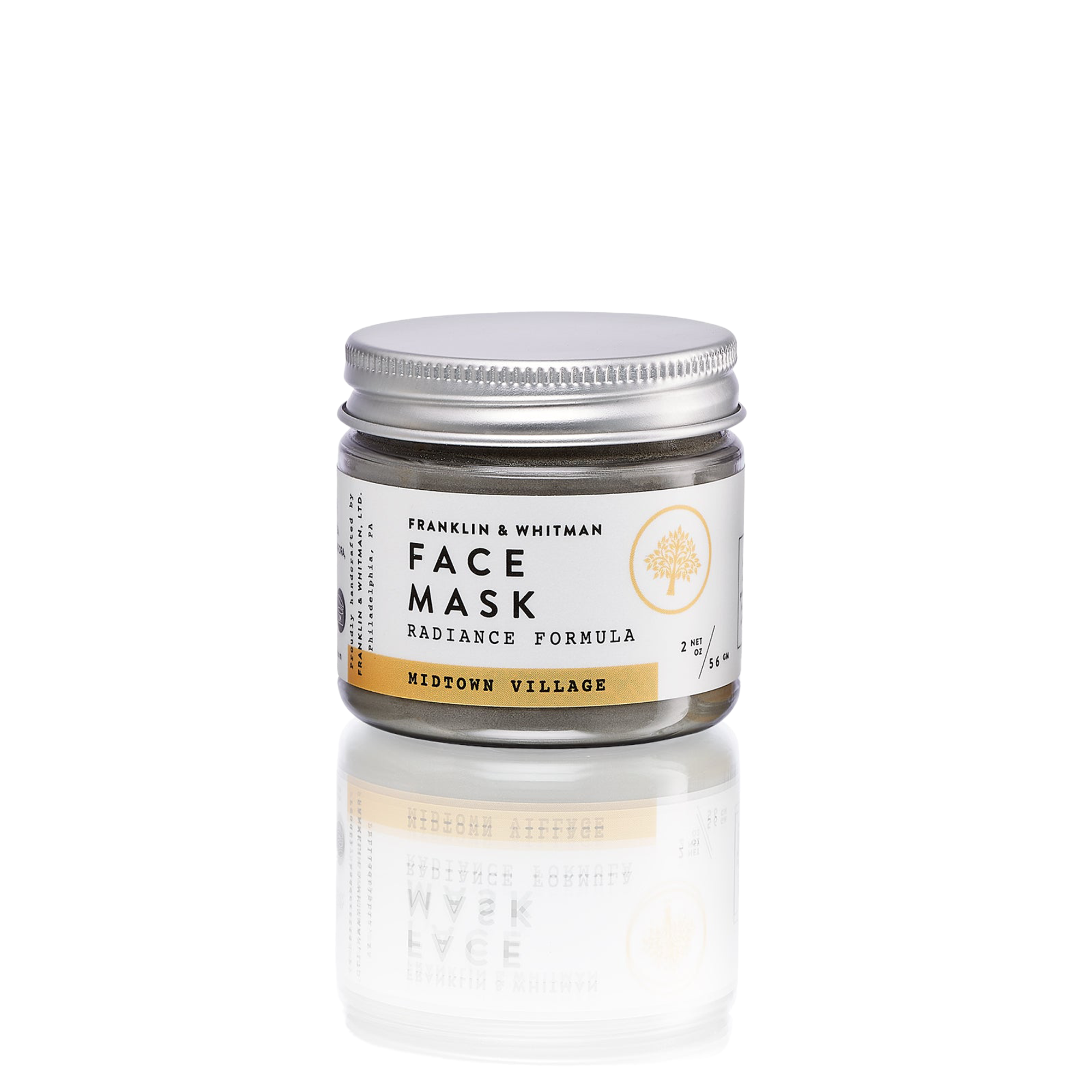 Midtown Village Clay Mask in a jar with a wooden spoon, showcasing its powdery texture and natural ingredients.