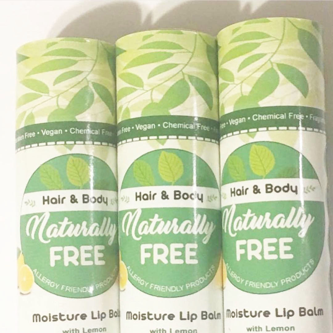 Organic Moisture Lip Balm in eco-friendly glass packaging, showcasing its natural ingredients and nut-free formula.