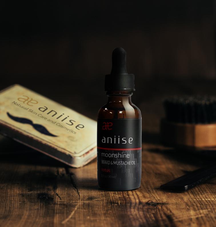 Bottle of Moonshine Beard and Mustache Oil with a dropper, showcasing its rich, golden color and natural ingredients.