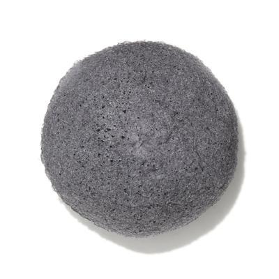 Natural Black Konjac Facial Sponge made from konjac root and bamboo charcoal, ideal for oily and acne-prone skin, shown wet and ready for use.