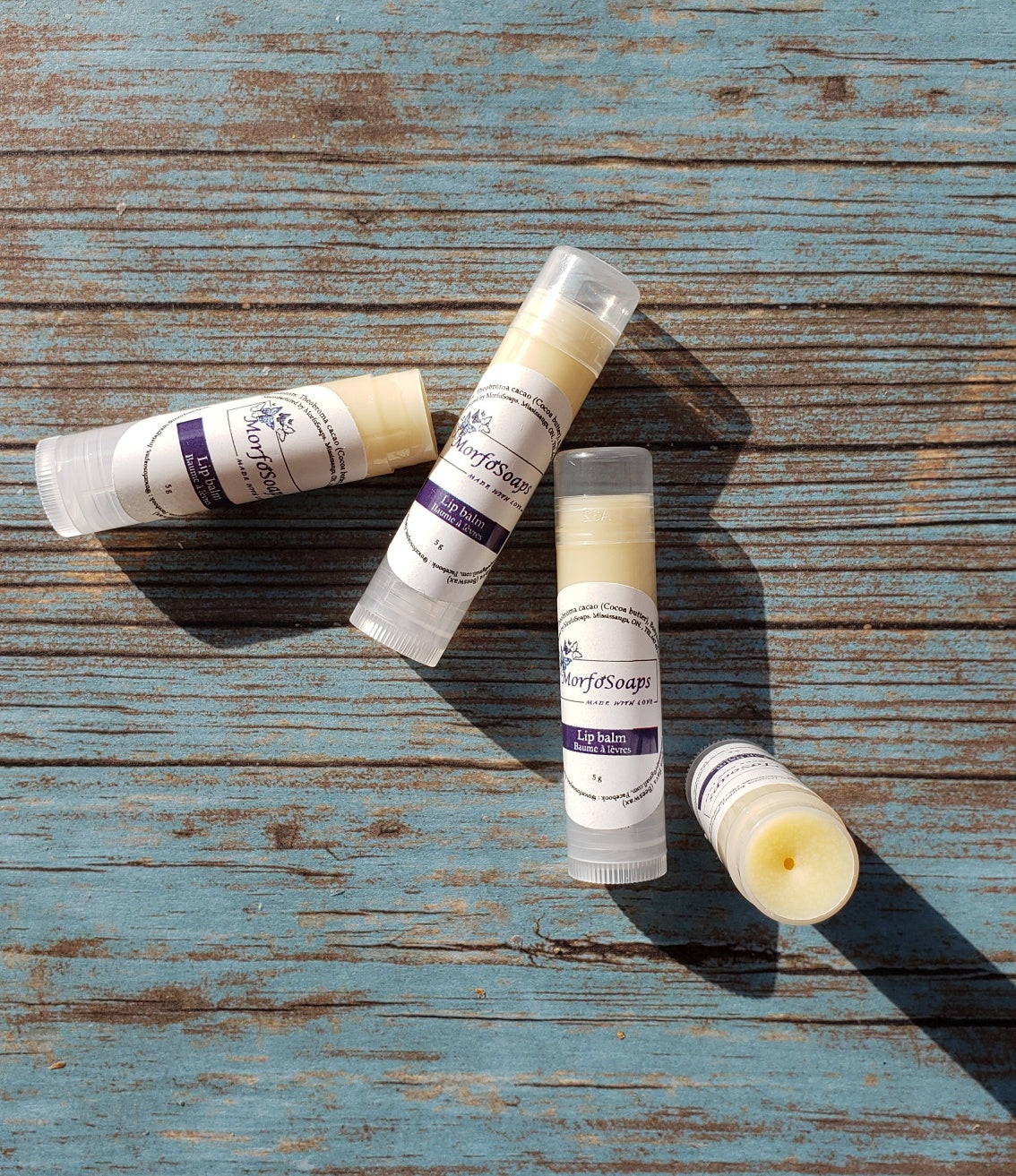 Natural Handmade Unscented Lip Balm in a tube, showcasing its creamy texture and organic ingredients.