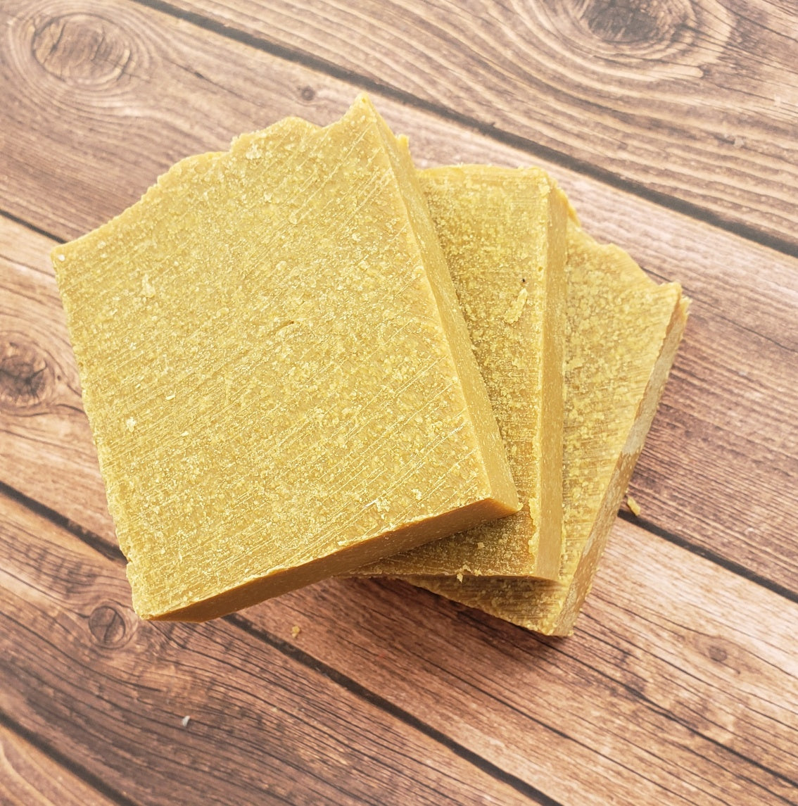 A bar of Natural Sulfur Soap showcasing its unique texture and color, handcrafted in Mississauga, Ontario.