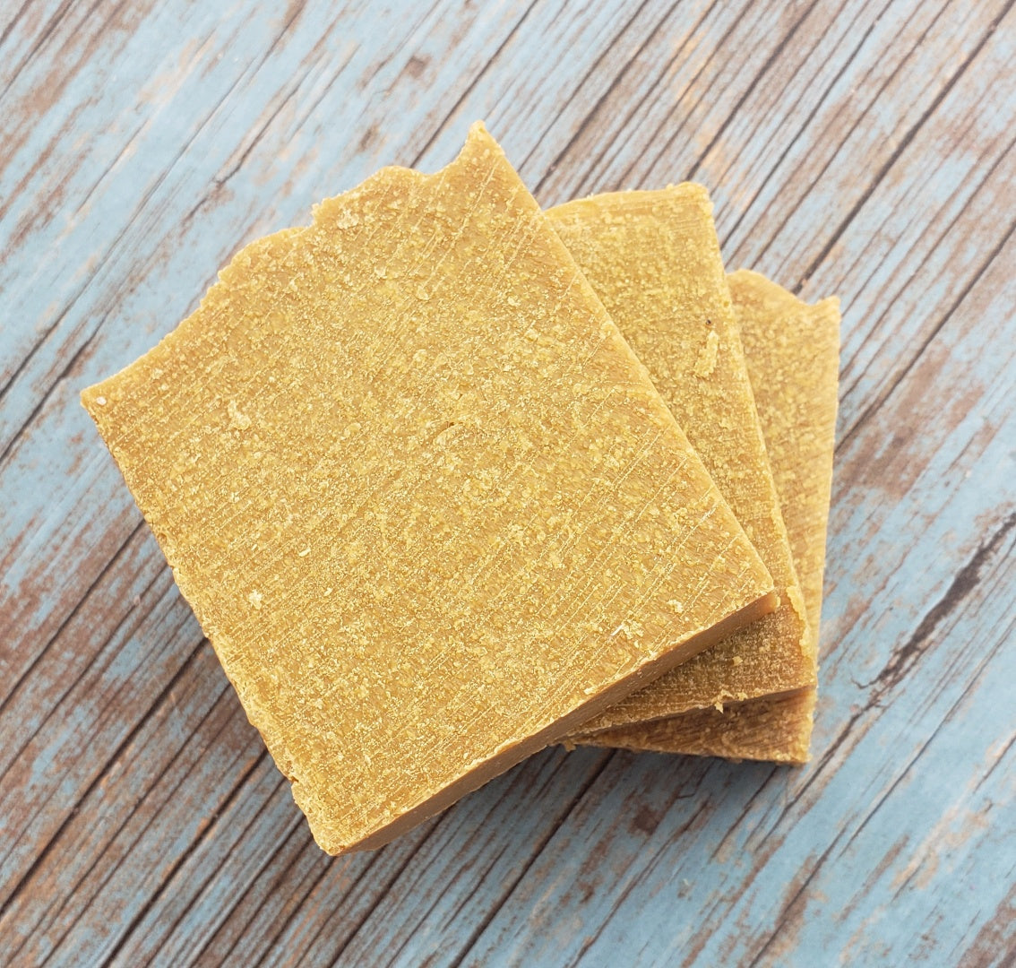 A bar of Natural Sulfur Soap showcasing its unique texture and color, handcrafted in Mississauga, Ontario.