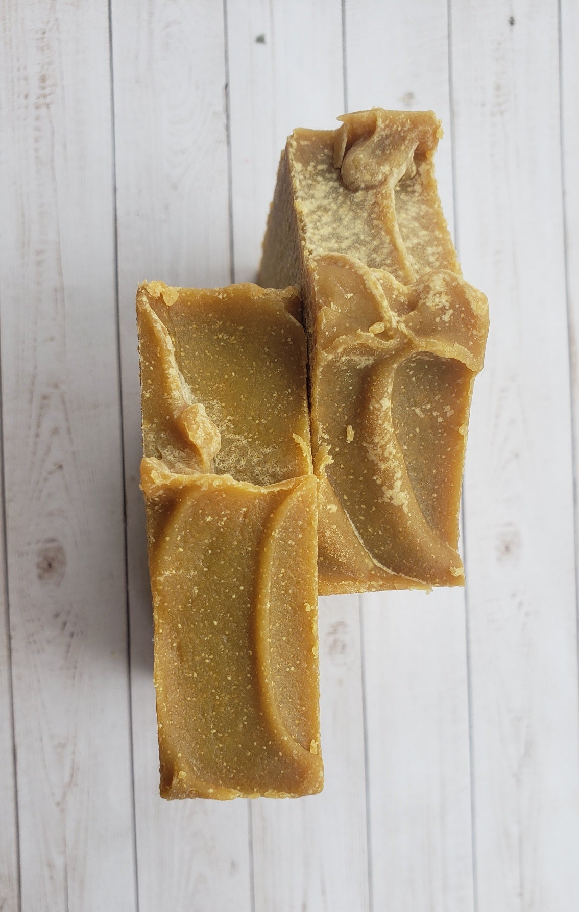 A bar of Natural Sulfur Soap showcasing its unique texture and color, handcrafted in Mississauga, Ontario.