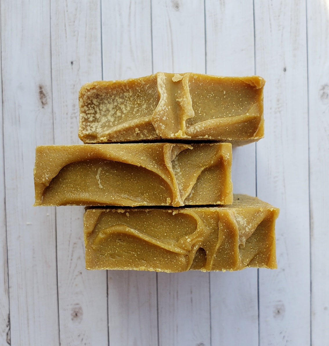 A bar of Natural Sulfur Soap showcasing its unique texture and color, handcrafted in Mississauga, Ontario.