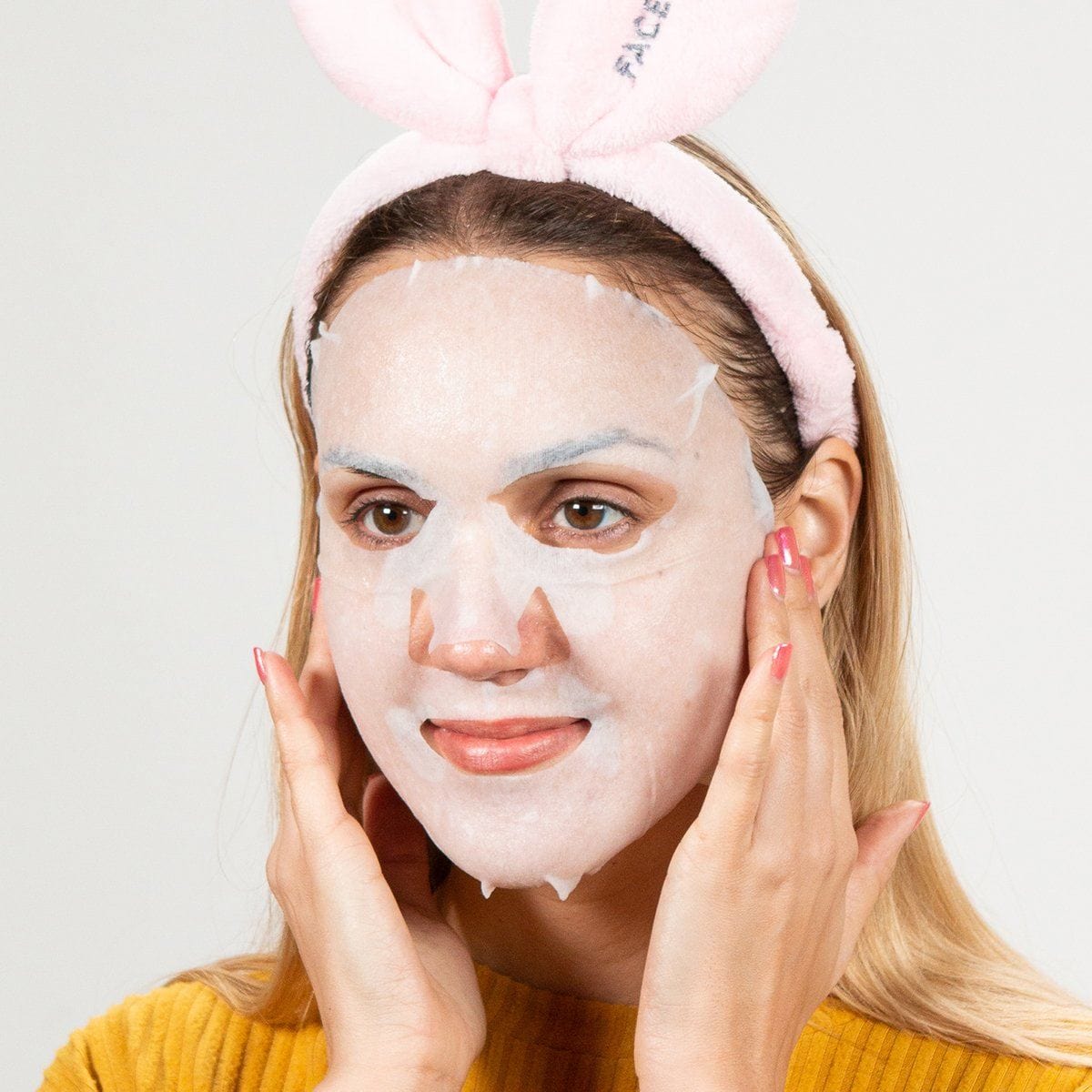 Oh My Goodness Rejuvenating Snail Mask displayed on a clean surface, showcasing its elegant packaging and sheet mask design.