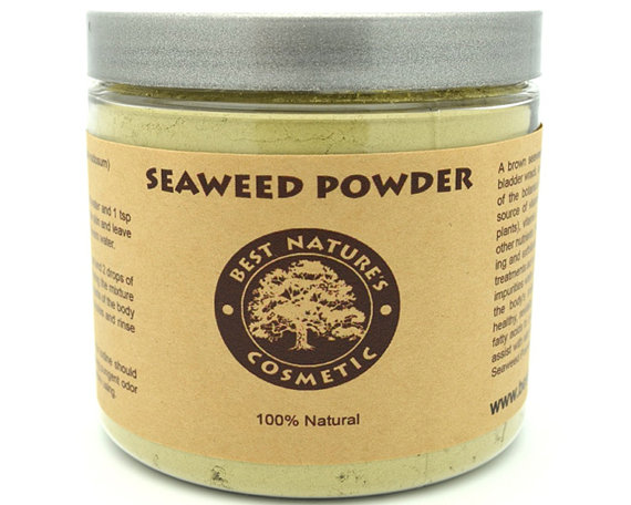 Organic Seaweed Kelp Powder in a clear container, showcasing its greenish-brown color and fine texture, ideal for skincare and culinary uses.