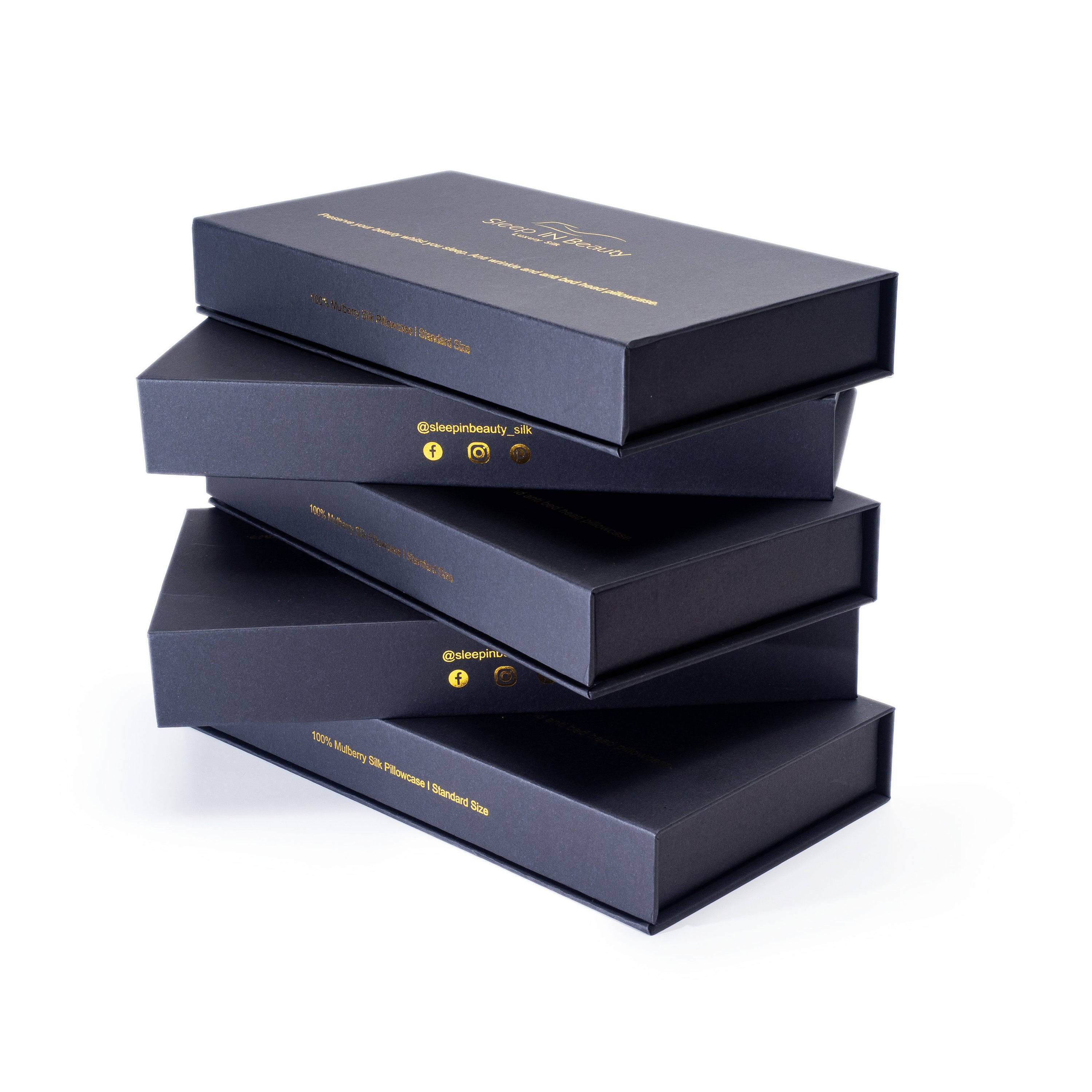 A pair of luxurious SIB™ silk pillowcases in elegant black and gold gift boxes, showcasing their soft texture and hidden zipper design.