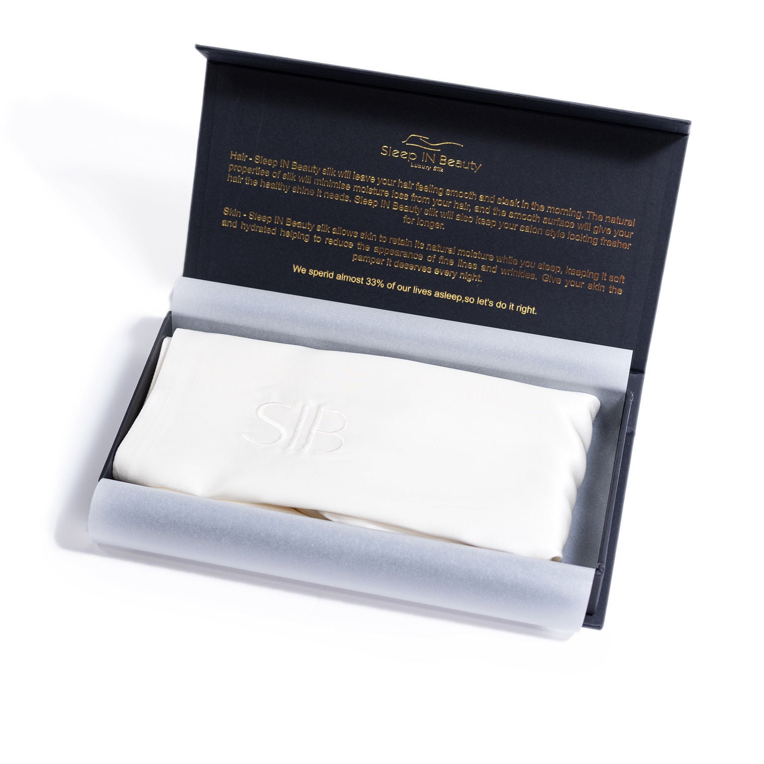 A pair of luxurious SIB™ silk pillowcases in elegant black and gold gift boxes, showcasing their soft texture and hidden zipper design.