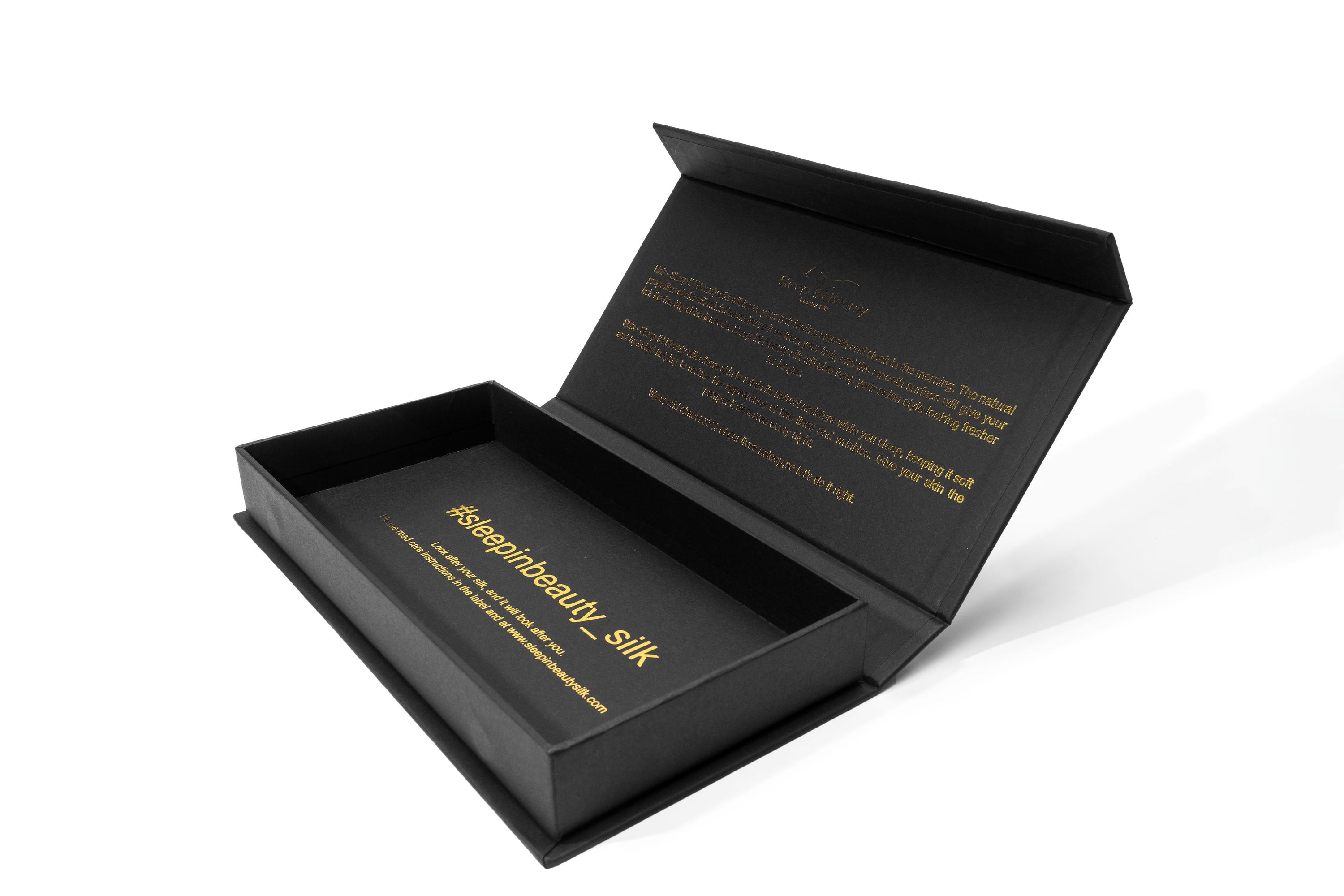 A pair of luxurious SIB™ silk pillowcases in elegant black and gold gift boxes, showcasing their soft texture and hidden zipper design.