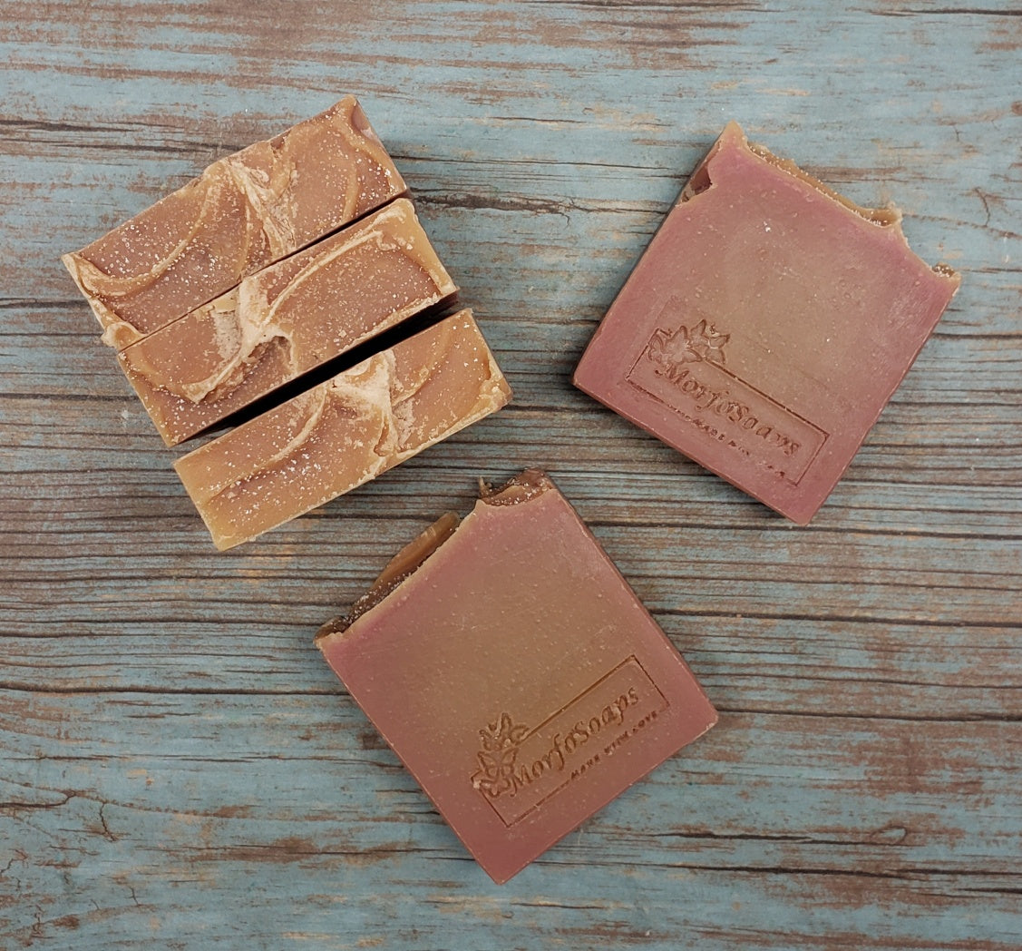 A bar of MorfoSoaps' Papaya Soap, showcasing its vibrant color and unique texture, made with real papaya extract and tropical fragrance.