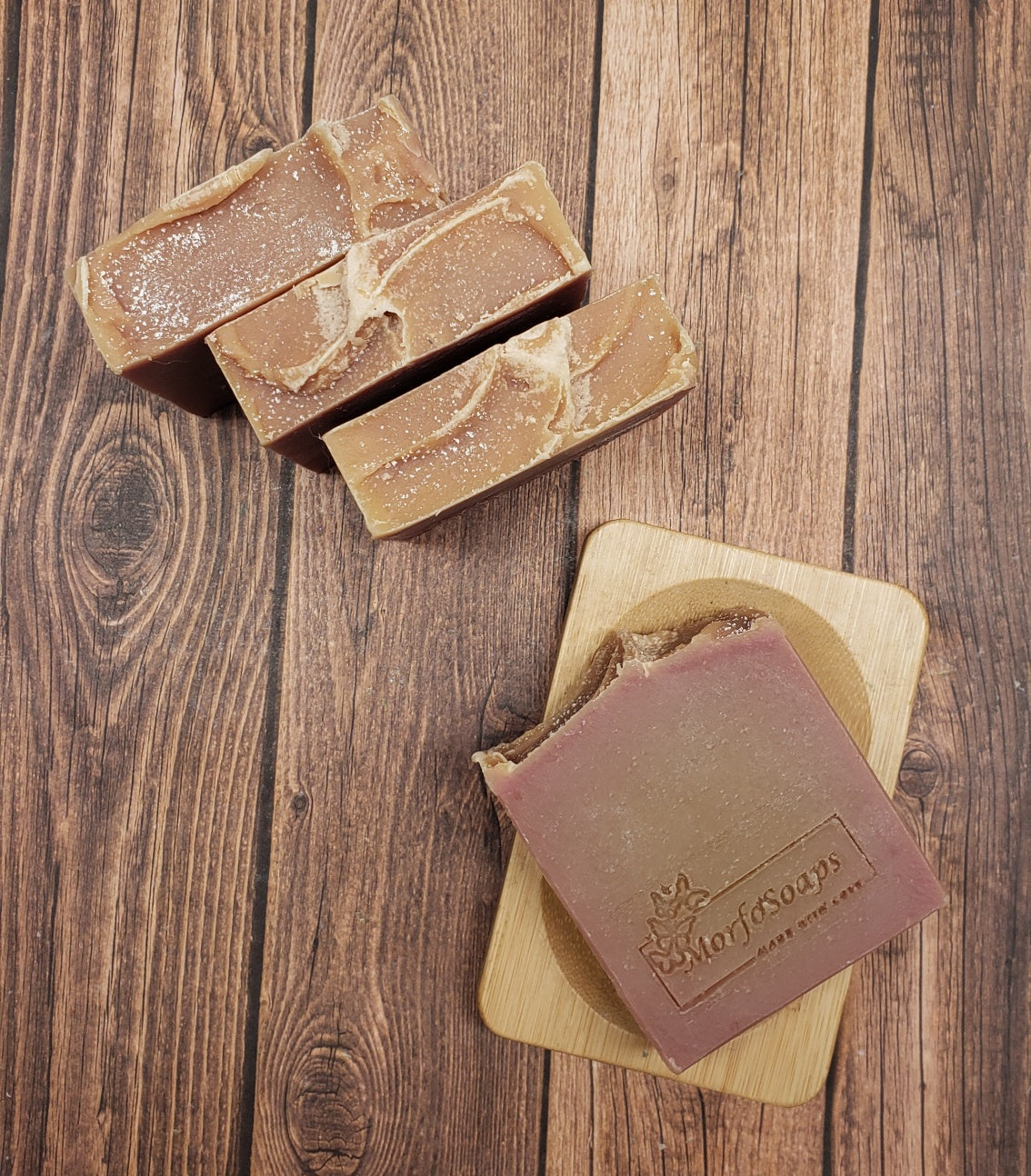 A bar of MorfoSoaps' Papaya Soap, showcasing its vibrant color and unique texture, made with real papaya extract and tropical fragrance.