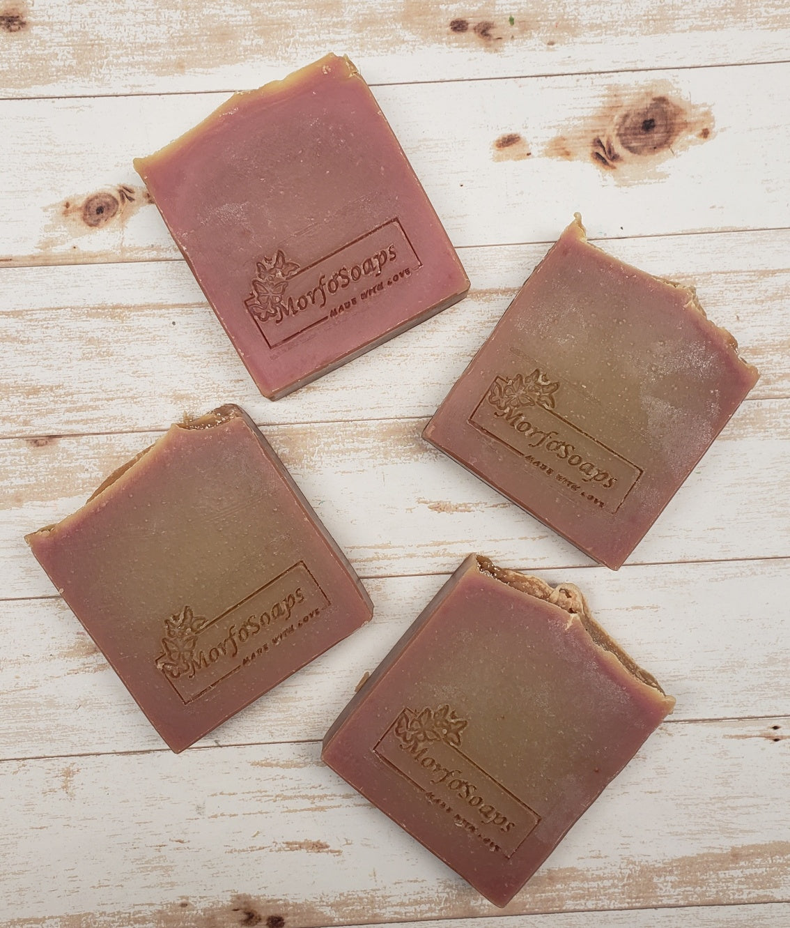 A bar of MorfoSoaps' Papaya Soap, showcasing its vibrant color and unique texture, made with real papaya extract and tropical fragrance.