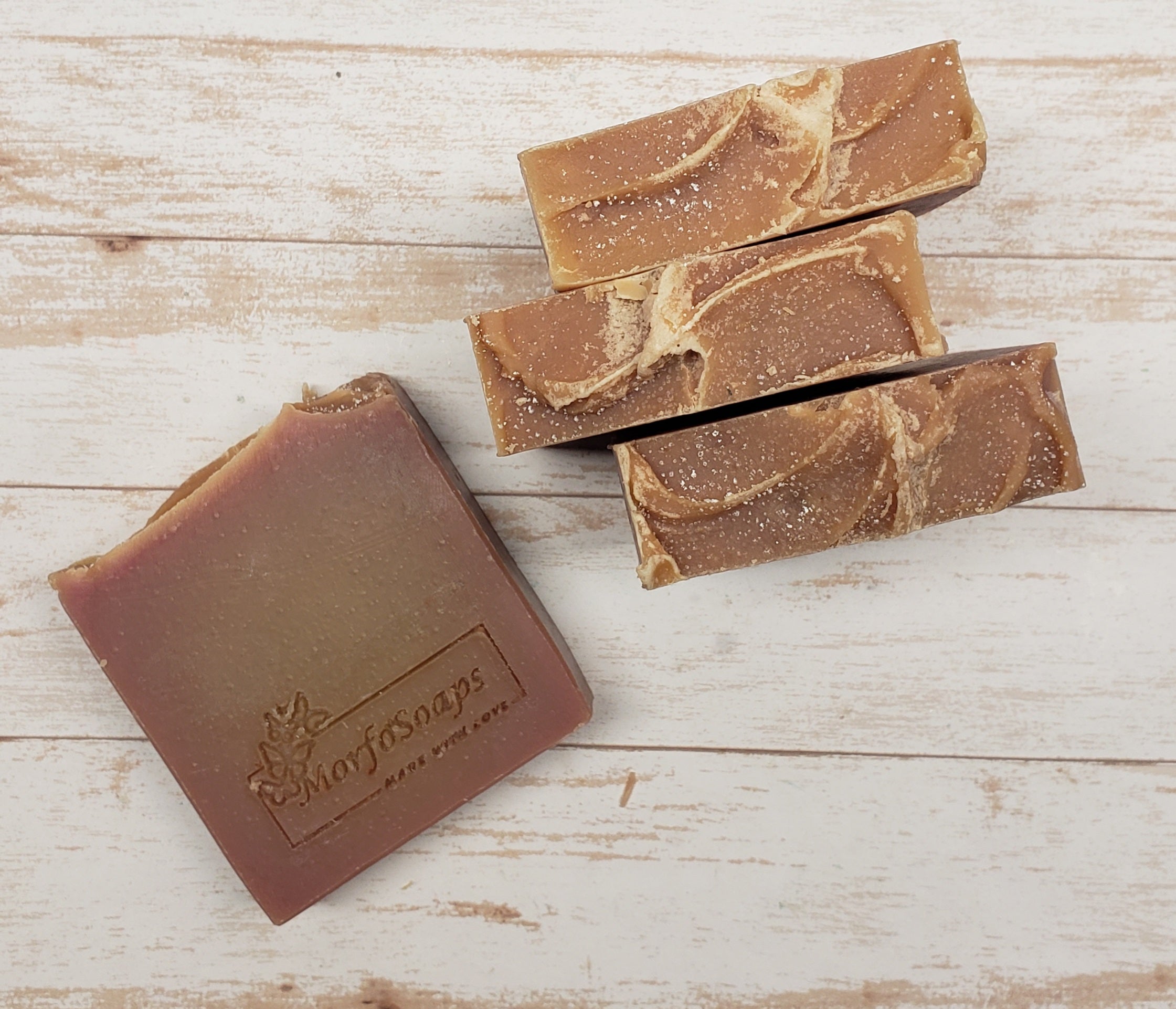 A bar of MorfoSoaps' Papaya Soap, showcasing its vibrant color and unique texture, made with real papaya extract and tropical fragrance.