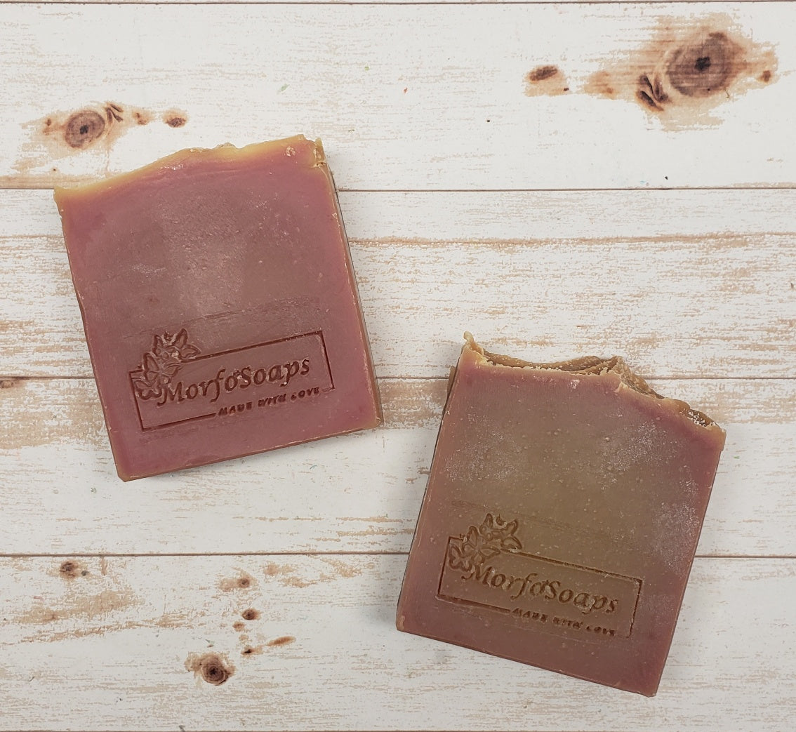 A bar of MorfoSoaps' Papaya Soap, showcasing its vibrant color and unique texture, made with real papaya extract and tropical fragrance.