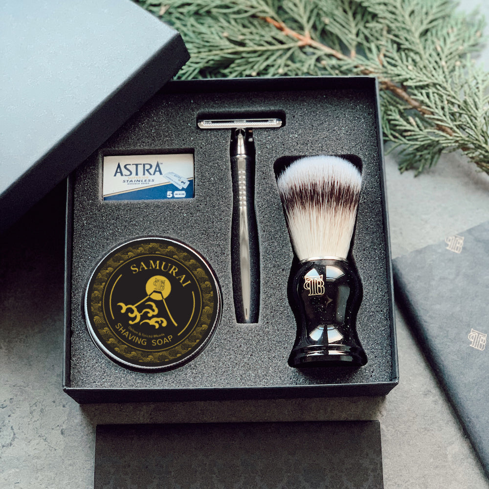 Premium Shaving Gift Set featuring a DE safety razor, shaving brush, shaving soap, and razor blades in a black gift box.