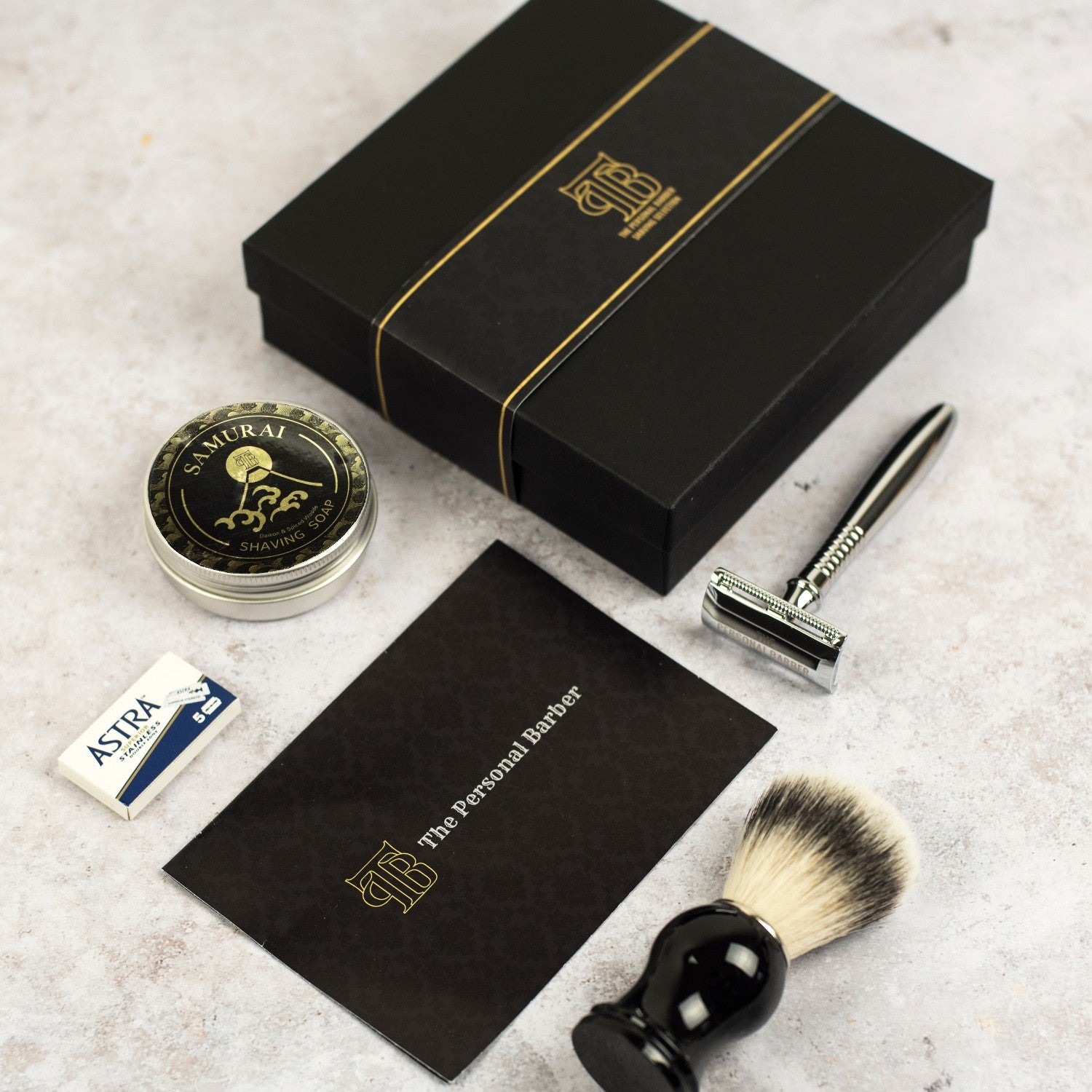 Premium Shaving Gift Set featuring a DE safety razor, shaving brush, shaving soap, and razor blades in a black gift box.