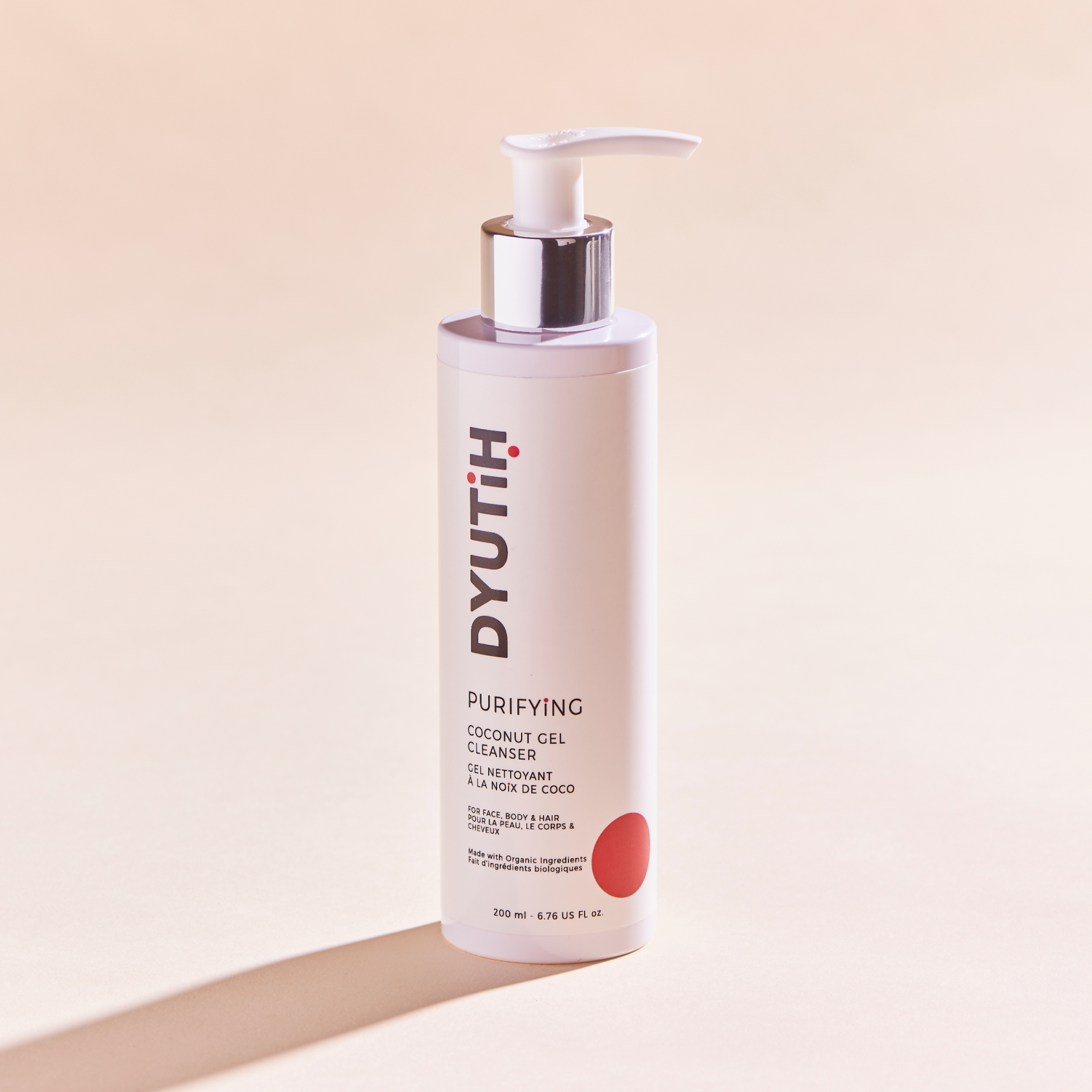 DYUTIH Organics PURIFYING Coconut Gel Cleanser in a sleek bottle, showcasing its natural ingredients like Coconut Oil and Aloe Vera.