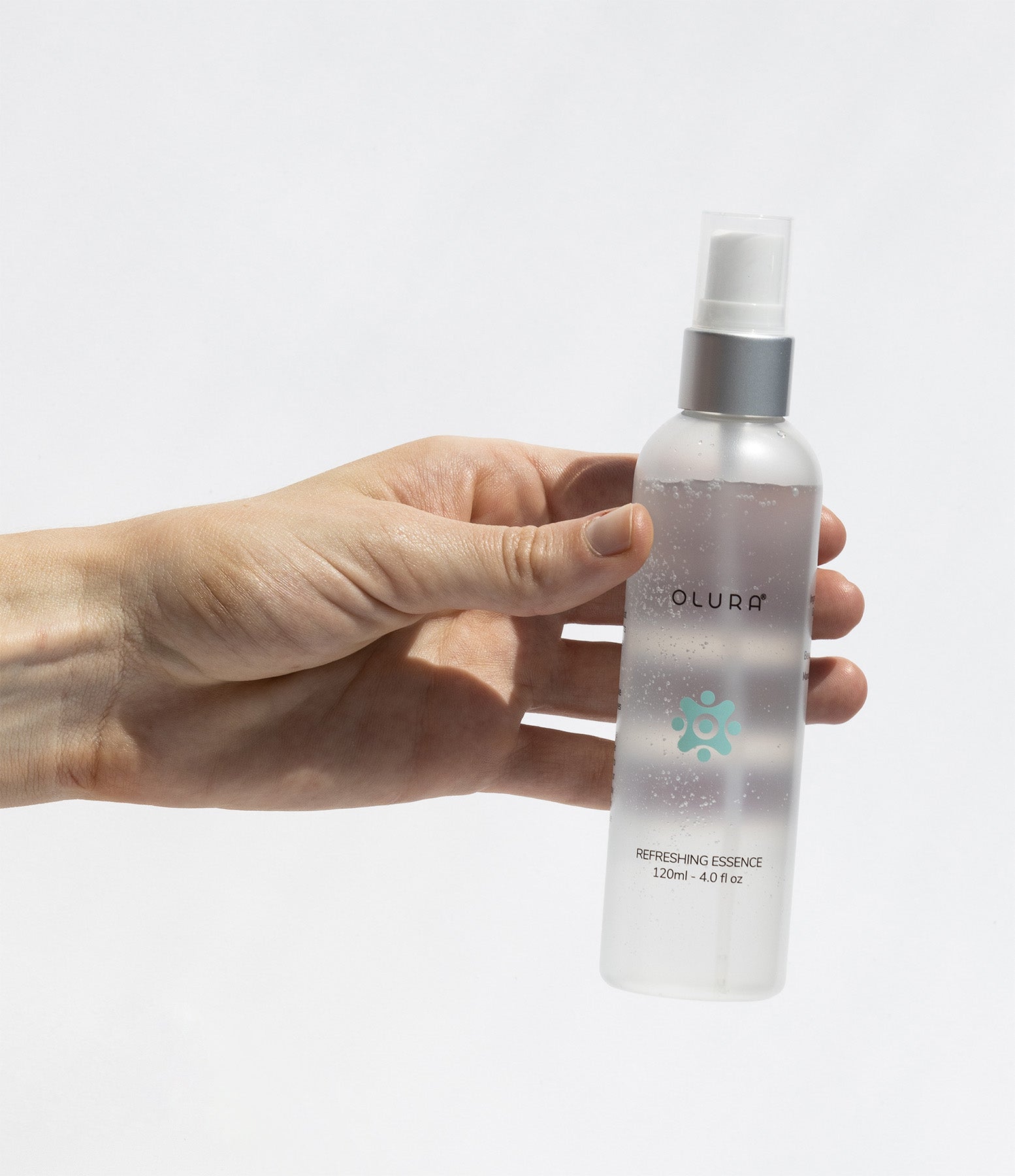 A bottle of REFRESHING ESSENCE, a hydrating skincare product with a sleek design, showcasing its lightweight formula.