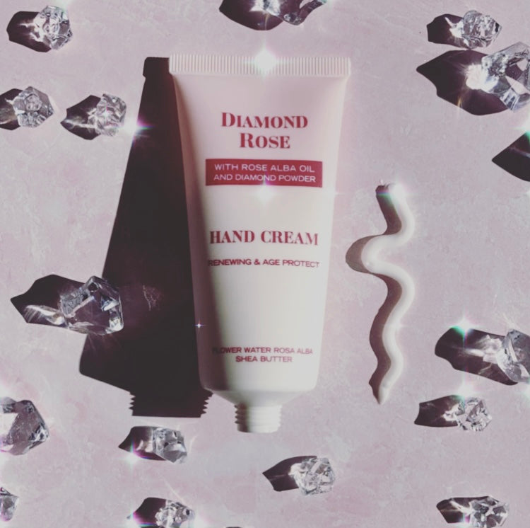 A 50 ml tube of Diamond Rose Biofresh Renewing Hand Cream with floral design, showcasing its luxurious and hydrating properties.