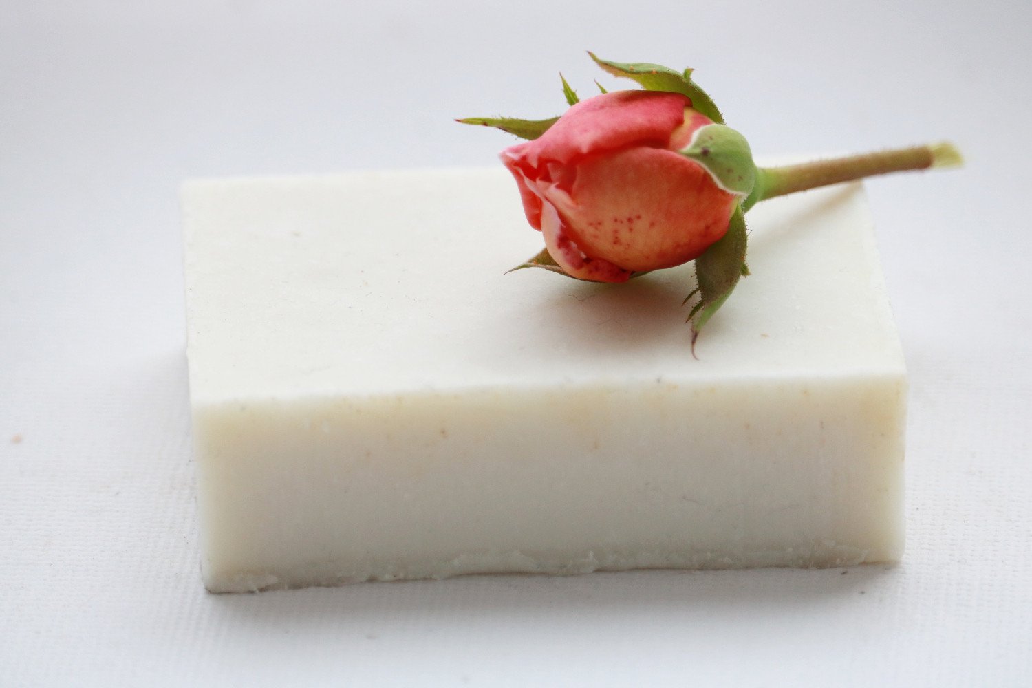 Rose Cardamom Soap Bar with floral design, showcasing its natural ingredients and luxurious texture.