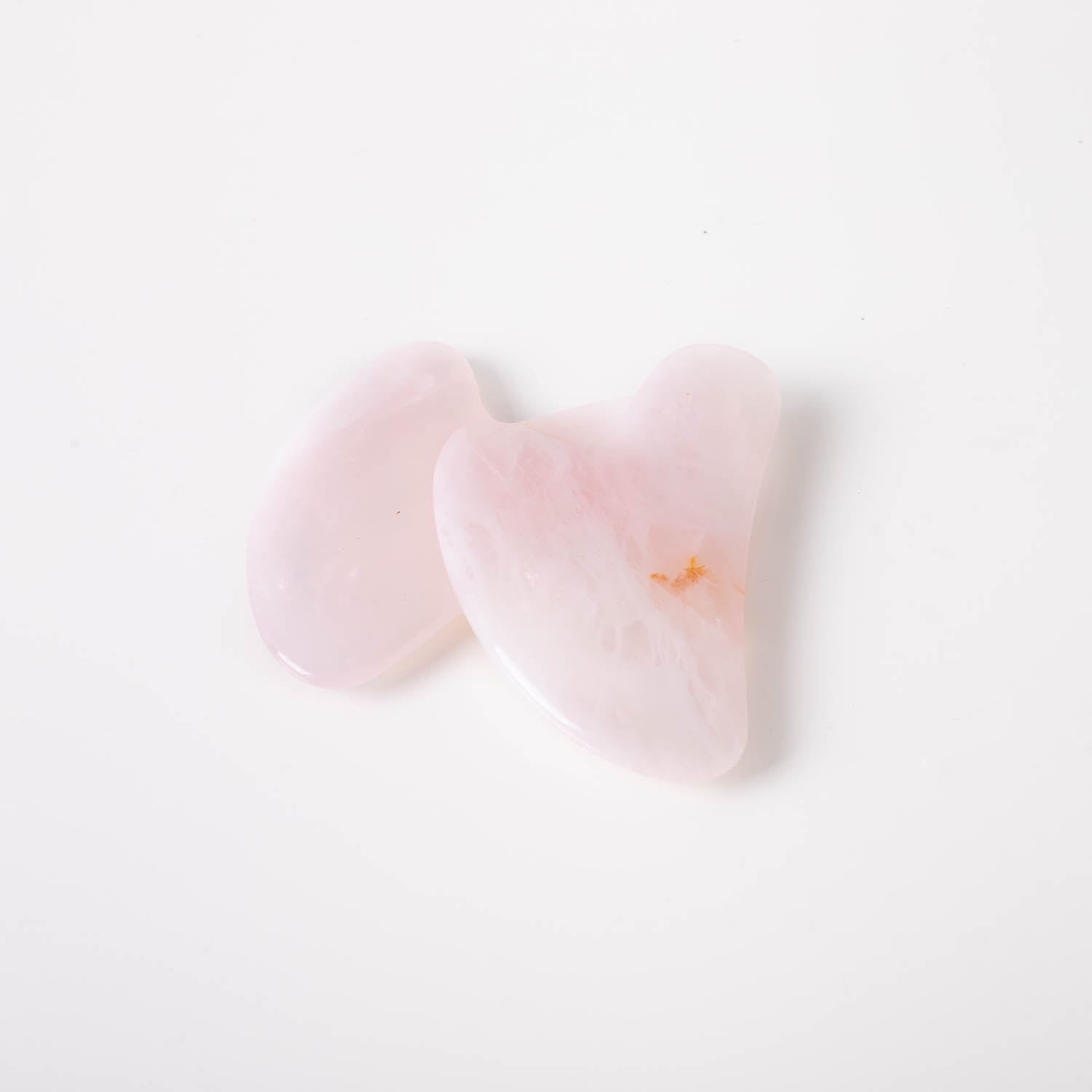 A beautifully crafted Rose Quartz Gua Sha tool, showcasing its smooth surface and elegant pink hue, perfect for facial massage.