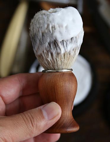 Limited edition Rosewood shaving brush with Super Badger Hair and engraved octopus logo, showcasing its elegant design and craftsmanship.