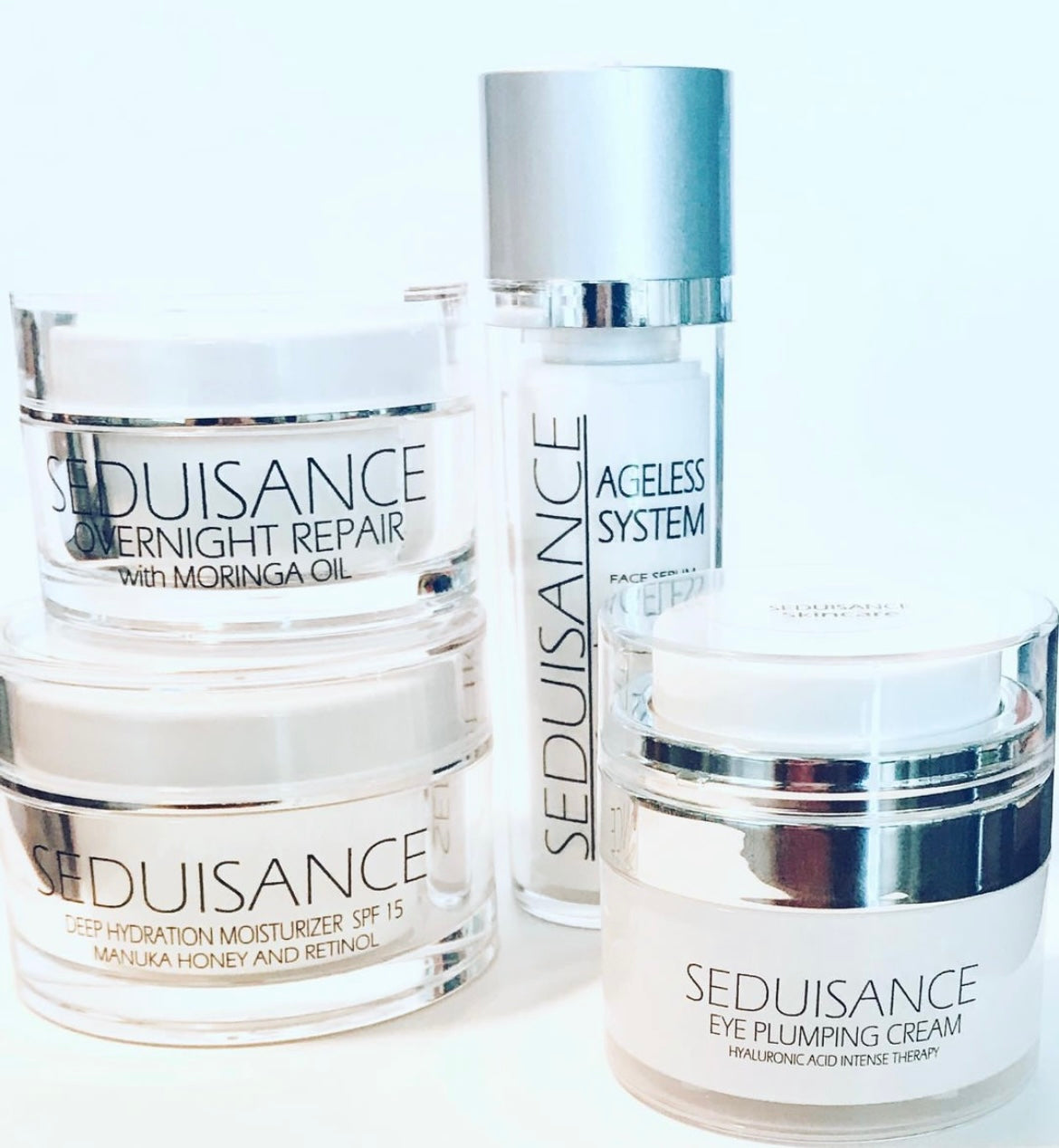 A collection of SEDUISANCE skincare products including moisturizer, serum, overnight repair, and eye cream, all featuring natural ingredients.