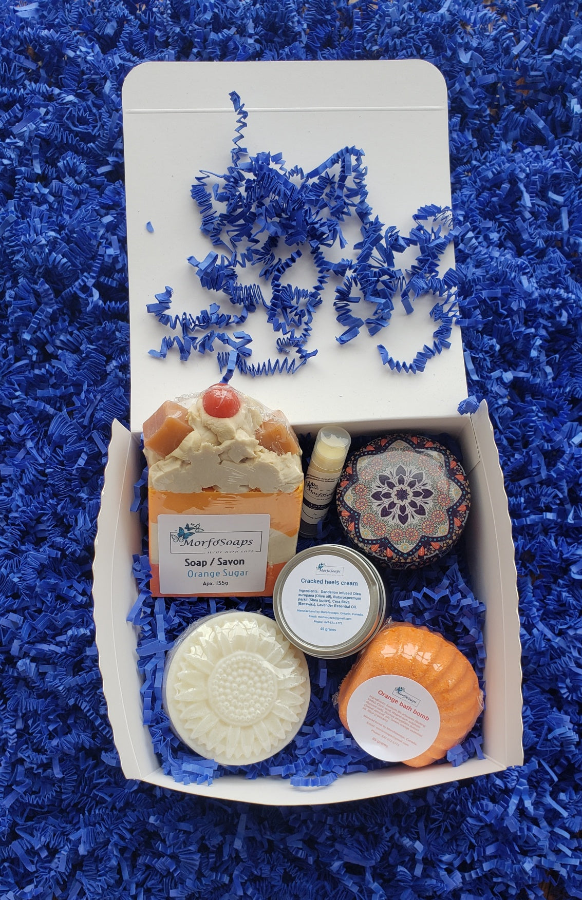 Self-Care Gift Box by Morfosoaps featuring artisan soaps, bath bomb, hand cream, and lip balm, beautifully packaged for gifting.