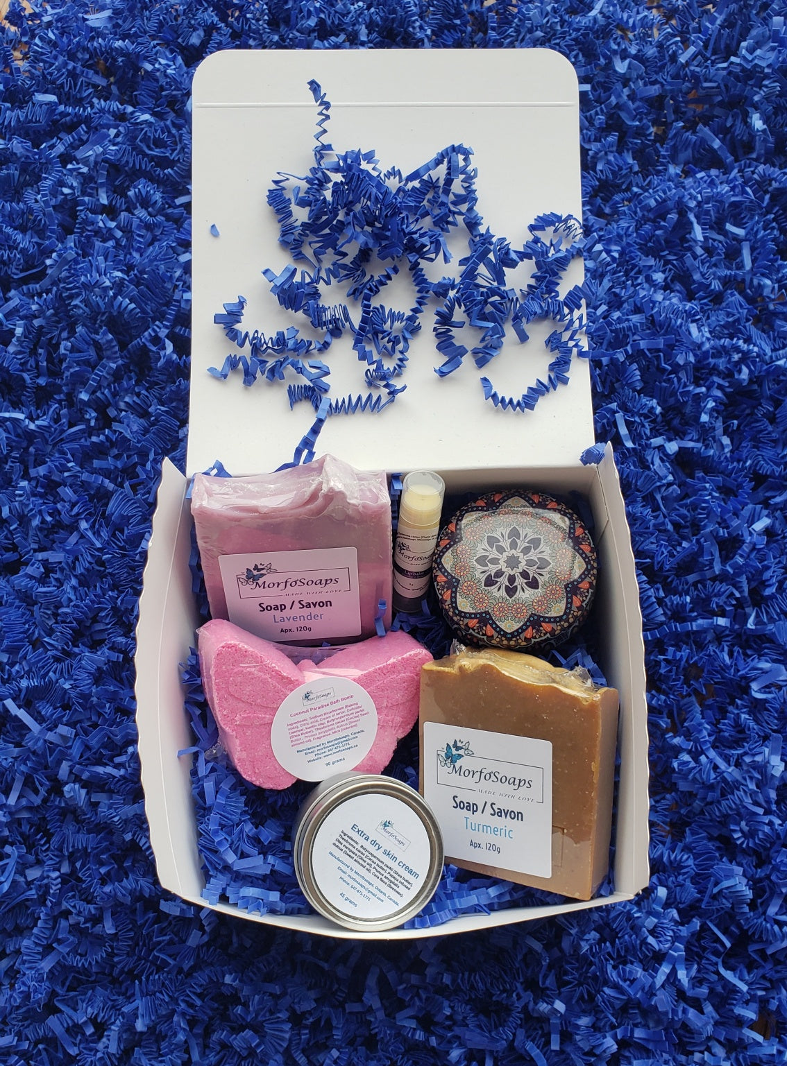 Self-Care Gift Box by Morfosoaps featuring artisan soaps, bath bomb, hand cream, and lip balm, beautifully packaged for gifting.