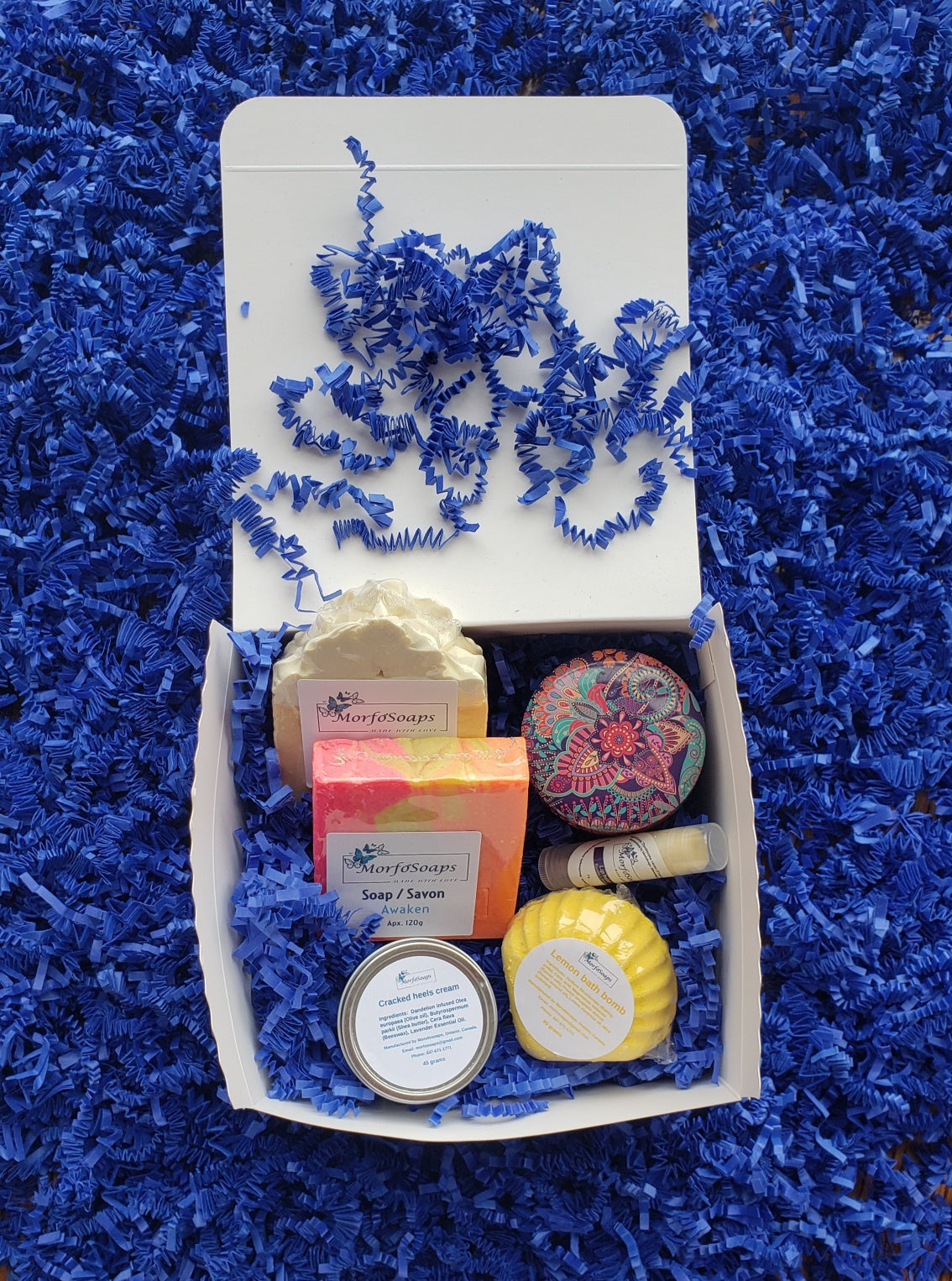 Self-Care Gift Box by Morfosoaps featuring artisan soaps, bath bomb, hand cream, and lip balm, beautifully packaged for gifting.