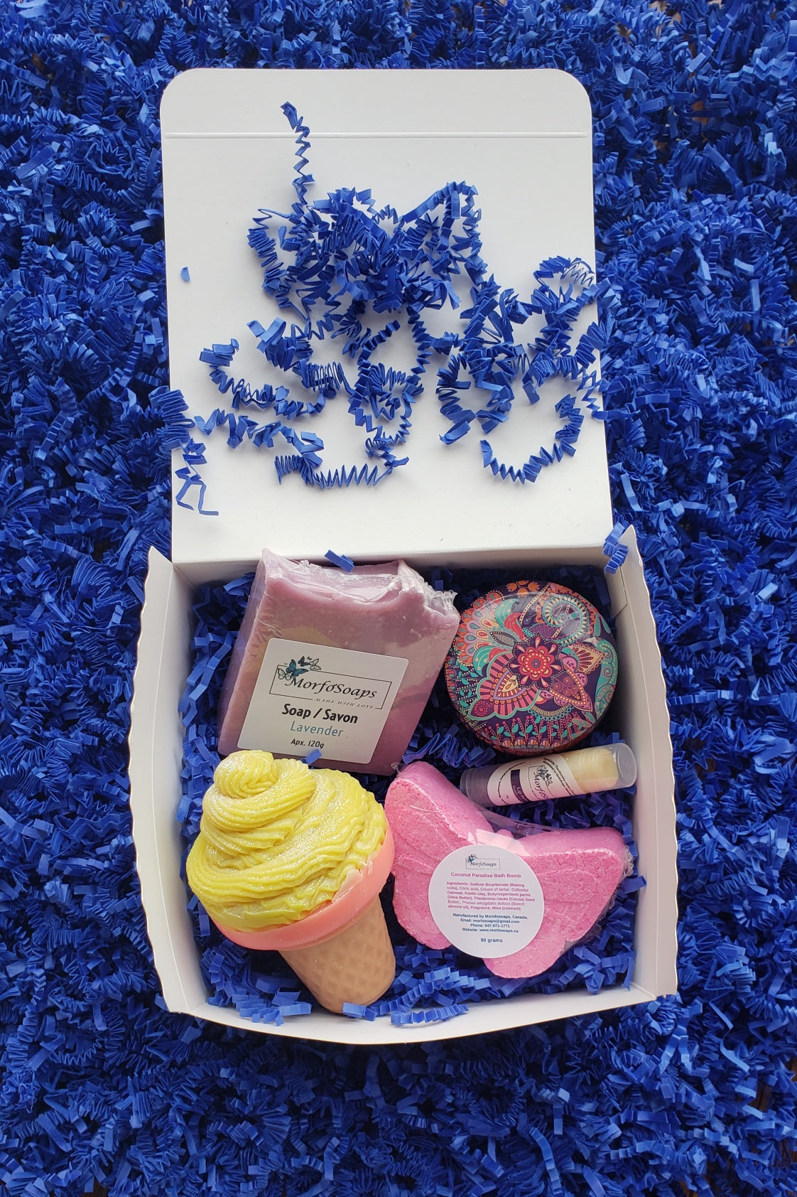 Self-Care Gift Box by Morfosoaps featuring artisan soaps, bath bomb, hand cream, and lip balm, beautifully packaged for gifting.