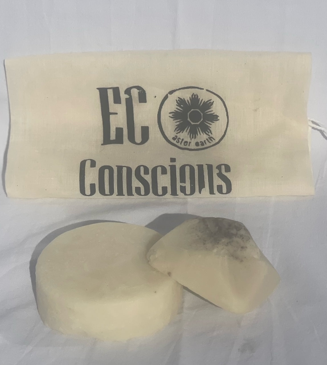 Aster Earth's Shampoo and Conditioner Bar Set featuring eco-friendly bars with rosemary and lemongrass scents, packaged in a reusable bag.