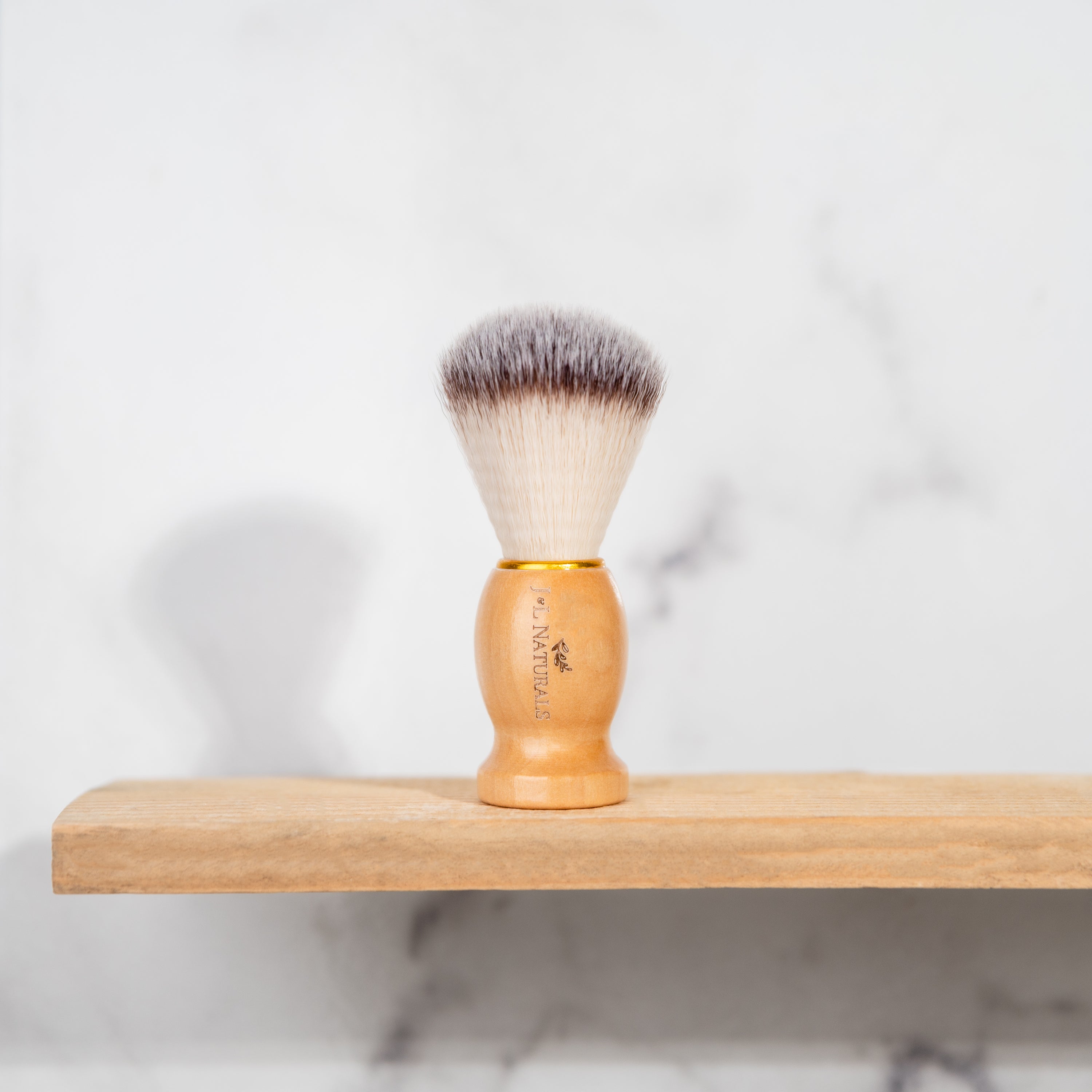 A high-quality Shave Brush with soft bristles, designed for creating lather and enhancing shaving experience.