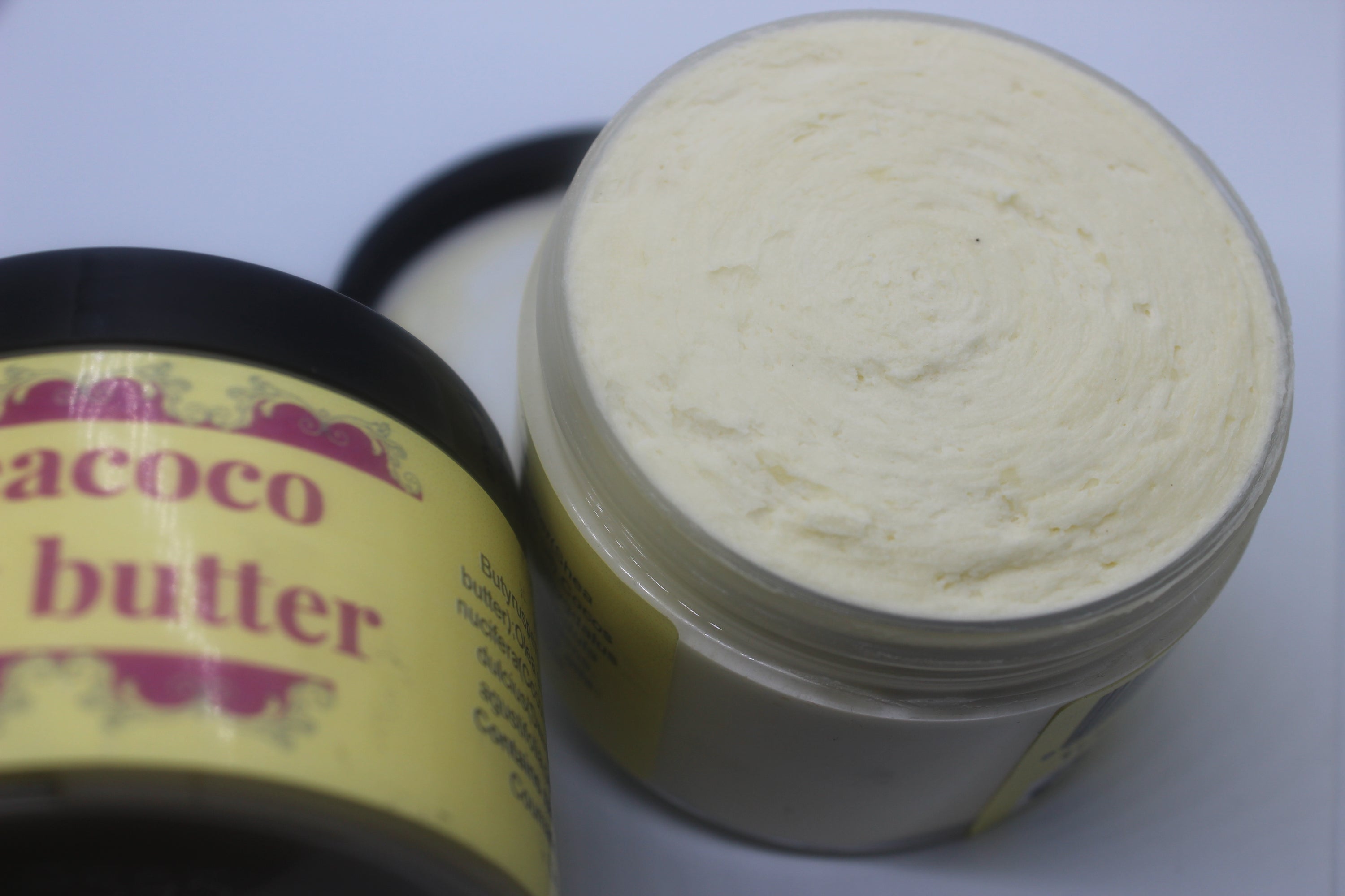 Sheacoco body butter in a PET container, showcasing its rich texture and natural ingredients.