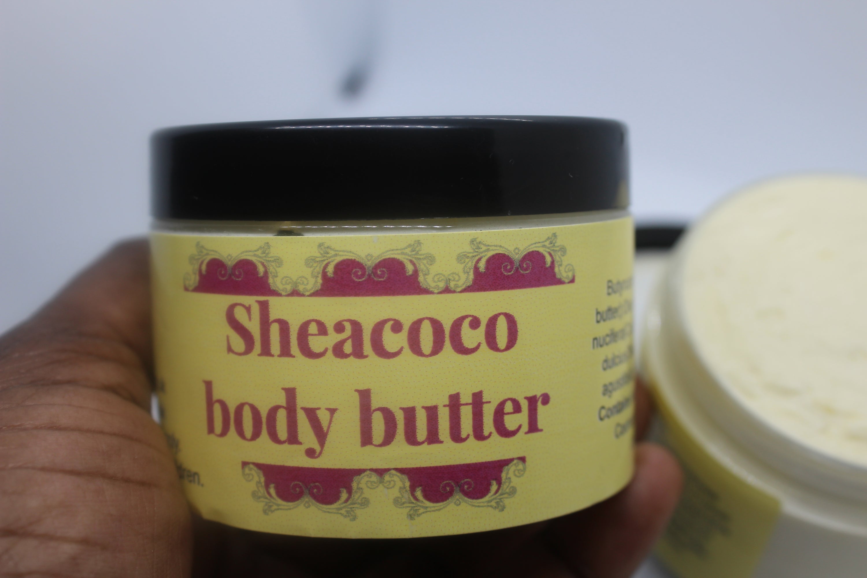 Sheacoco body butter in a PET container, showcasing its rich texture and natural ingredients.