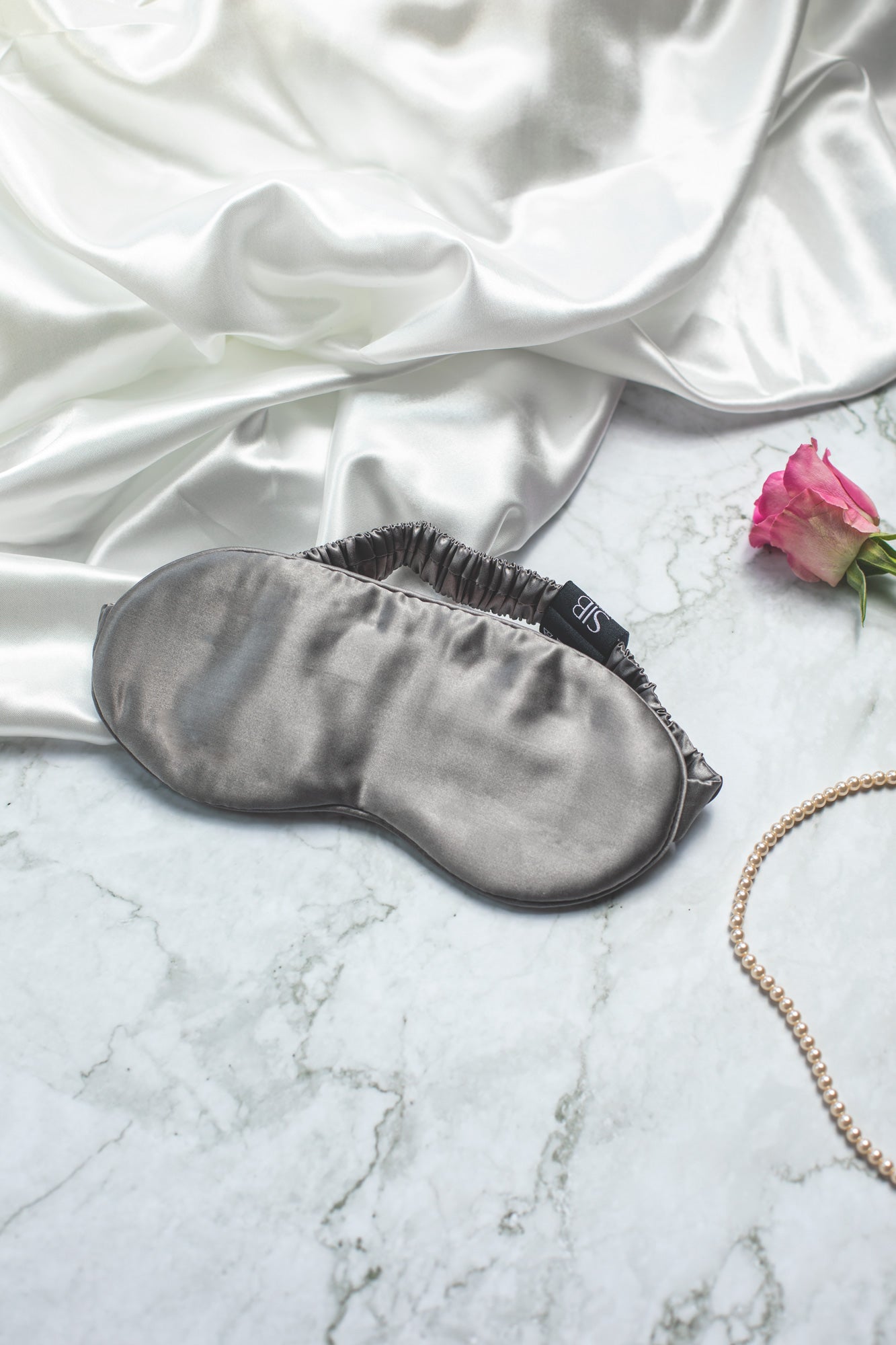 SIB™ mulberry silk eye mask in luxurious silk with matching pouch, designed for comfort and hydration.