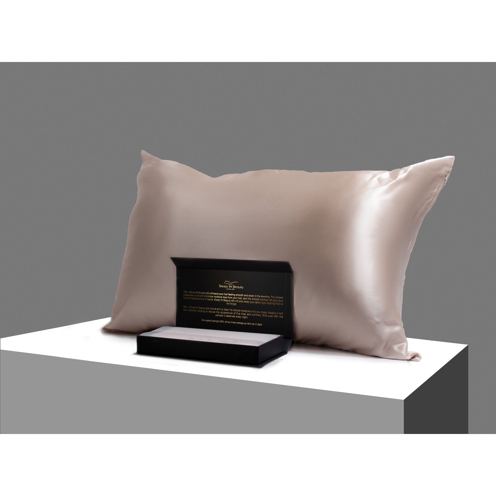 SIB™ Silk Pillowcase in luxurious black silk with hidden zipper, elegantly presented in a gold gift box.