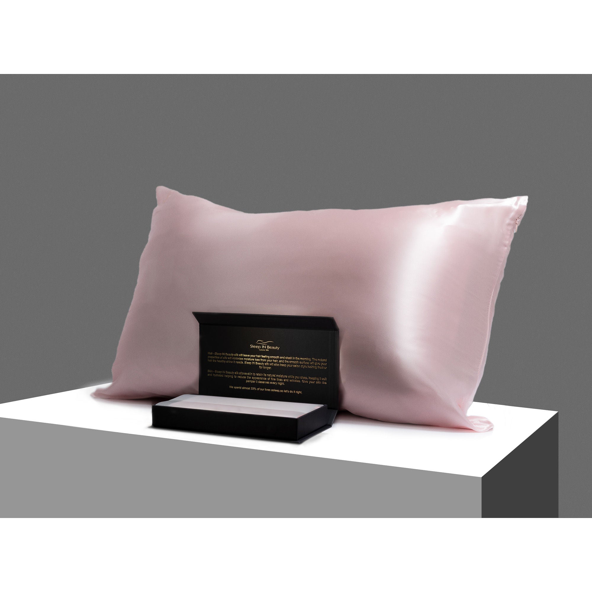 SIB™ Silk Pillowcase in luxurious black silk with hidden zipper, elegantly presented in a gold gift box.