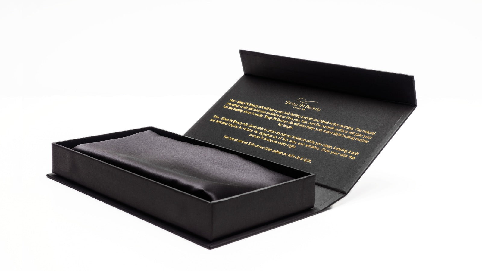 SIB™ Silk Pillowcase in luxurious black silk with hidden zipper, elegantly presented in a gold gift box.