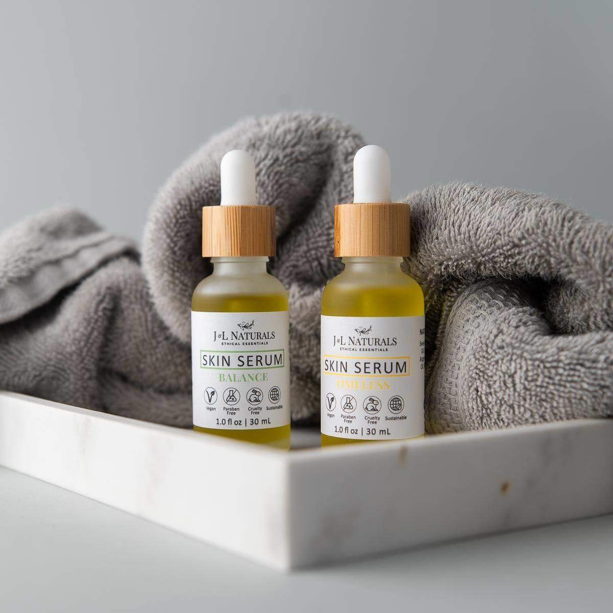 Skin Serum Duo featuring two 1.0 fl oz bottles with natural ingredients for various skin types.