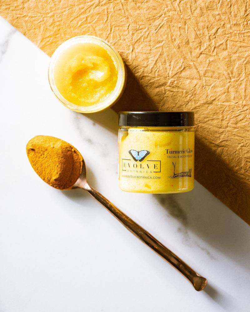 A jar of Turmeric Glow Facial Polish with a vibrant yellow color, showcasing its natural ingredients like turmeric and argan oil.