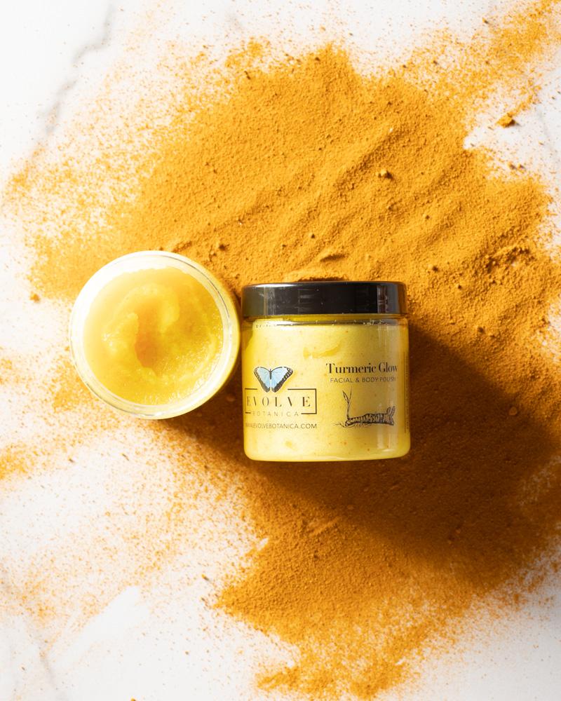 A jar of Turmeric Glow Facial Polish with a vibrant yellow color, showcasing its natural ingredients like turmeric and argan oil.