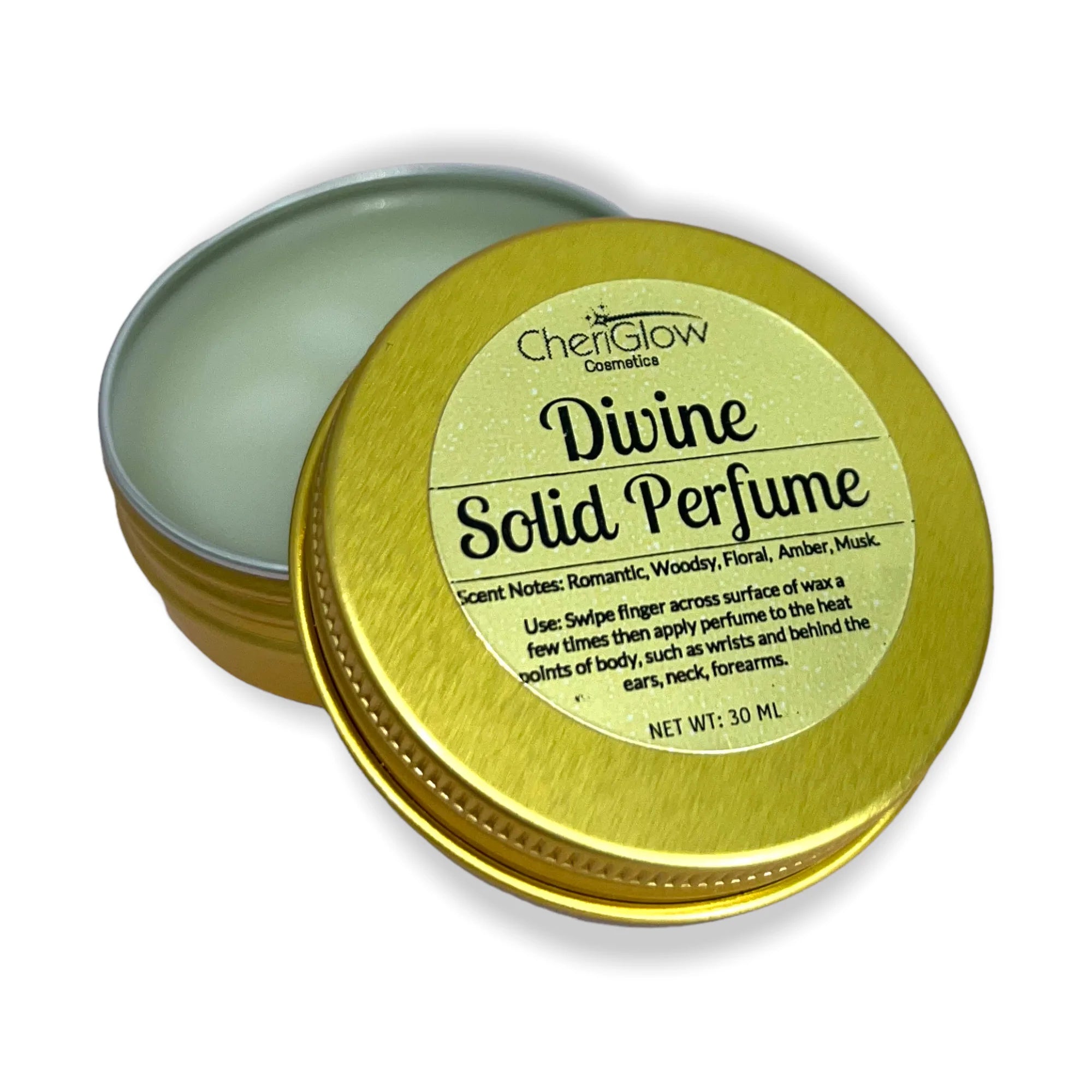 Divine Solid Perfume in a gold metal tin, showcasing its elegant design and compact size for easy portability.