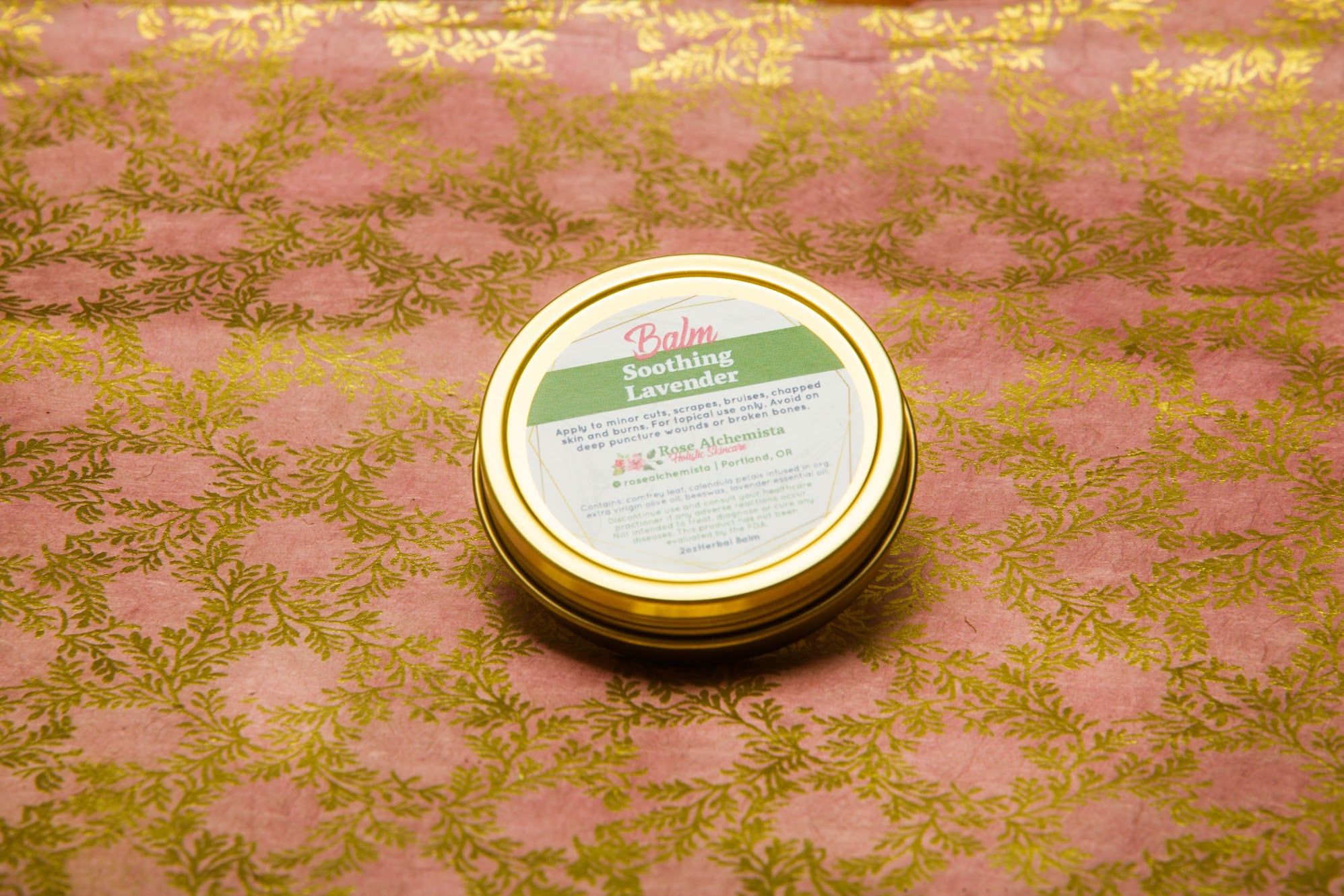 Soothing Lavender Balm in a 2oz travel twist tin, featuring vibrant green color and lavender scent, ideal for skin rejuvenation.