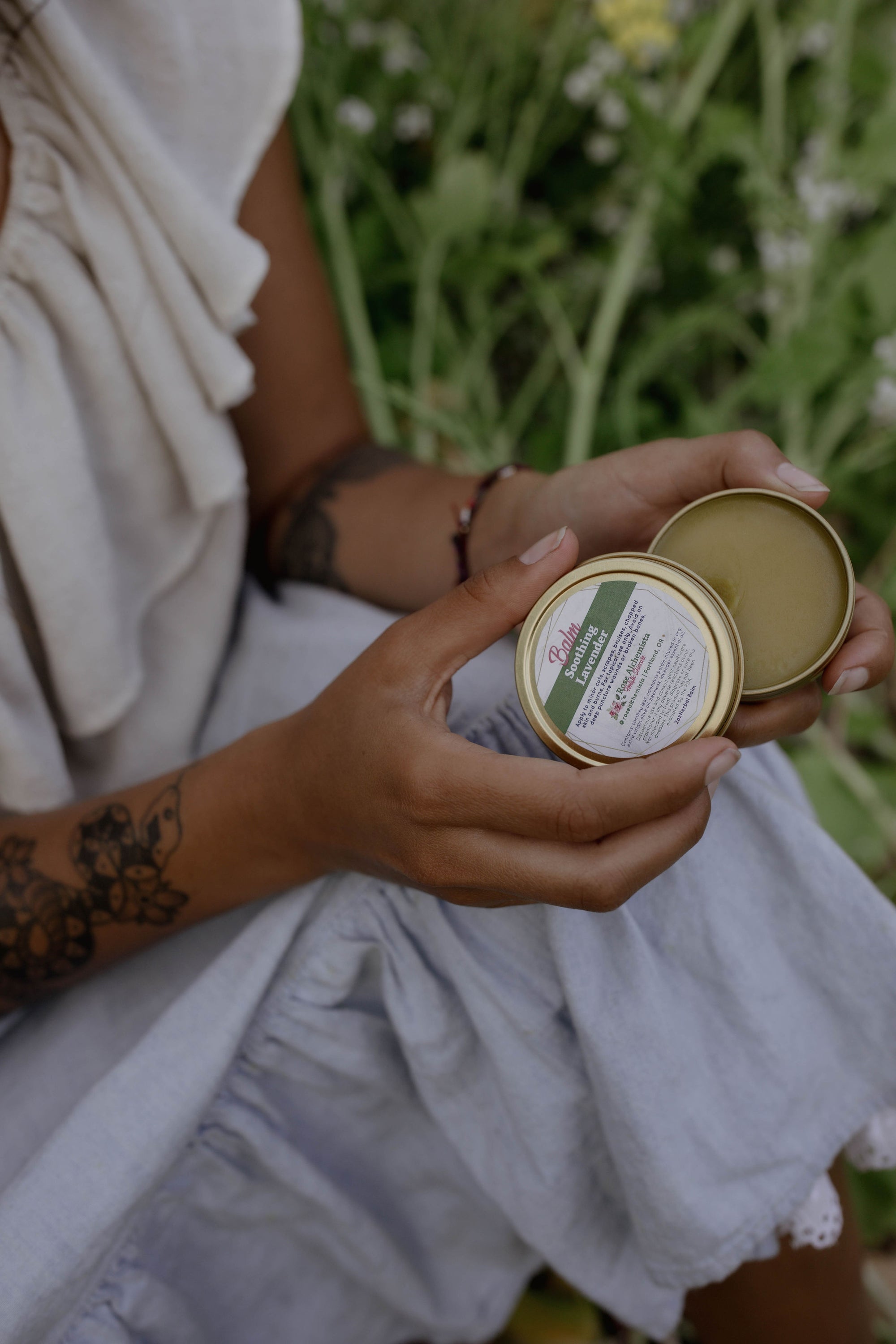 Soothing Lavender Balm in a 2oz travel twist tin, featuring vibrant green color and lavender scent, ideal for skin rejuvenation.