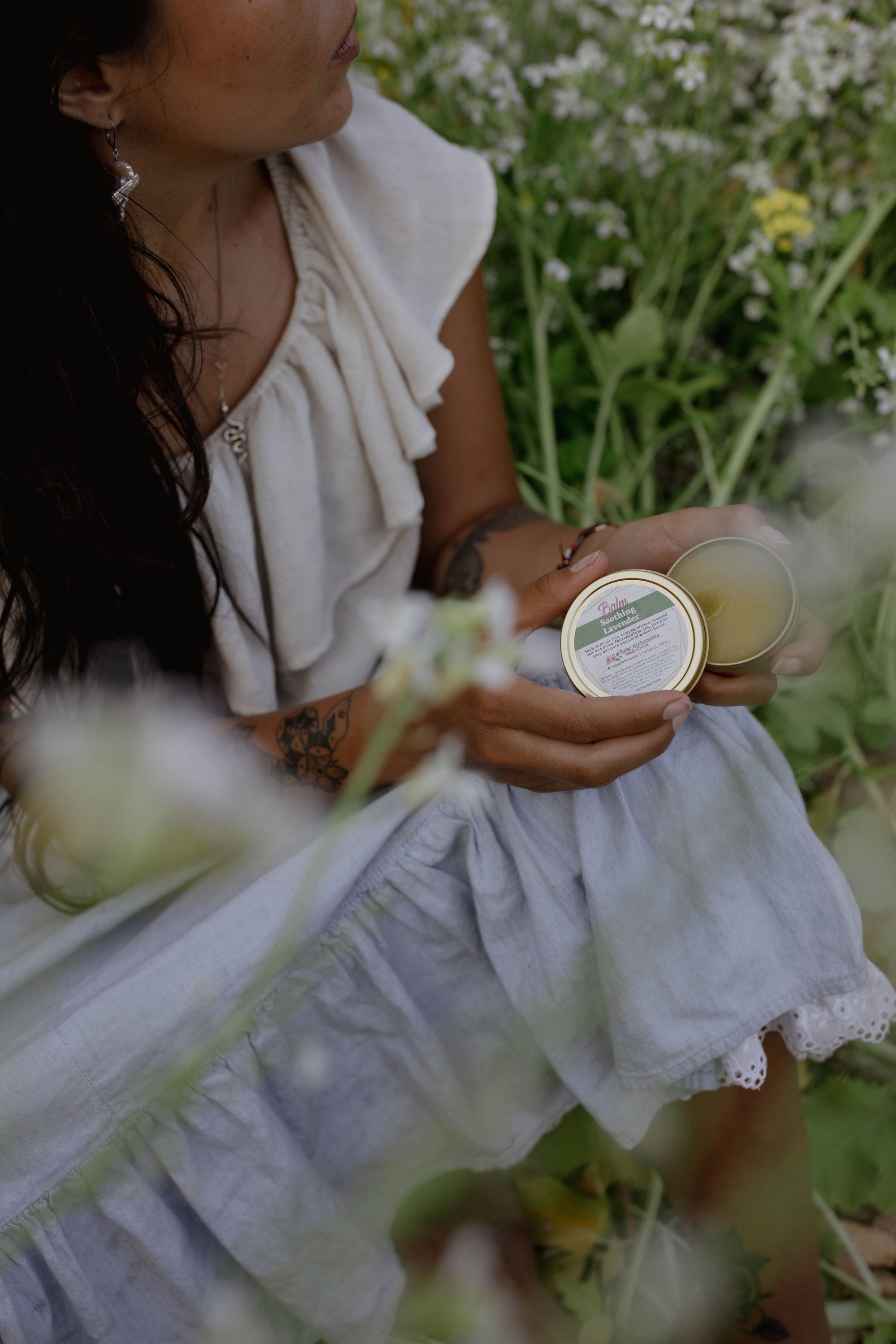 Soothing Lavender Balm in a 2oz travel twist tin, featuring vibrant green color and lavender scent, ideal for skin rejuvenation.