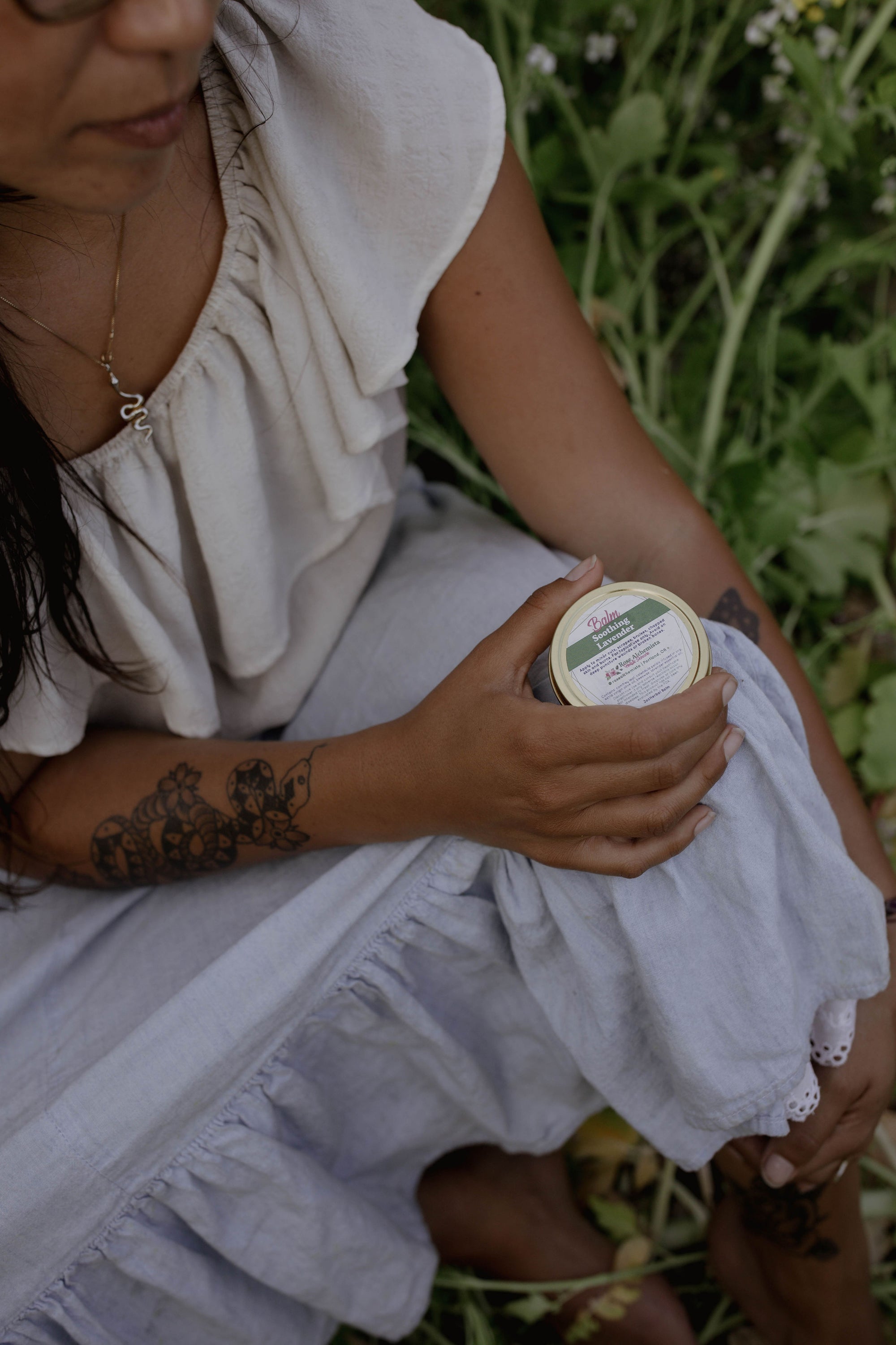 Soothing Lavender Balm in a 2oz travel twist tin, featuring vibrant green color and lavender scent, ideal for skin rejuvenation.